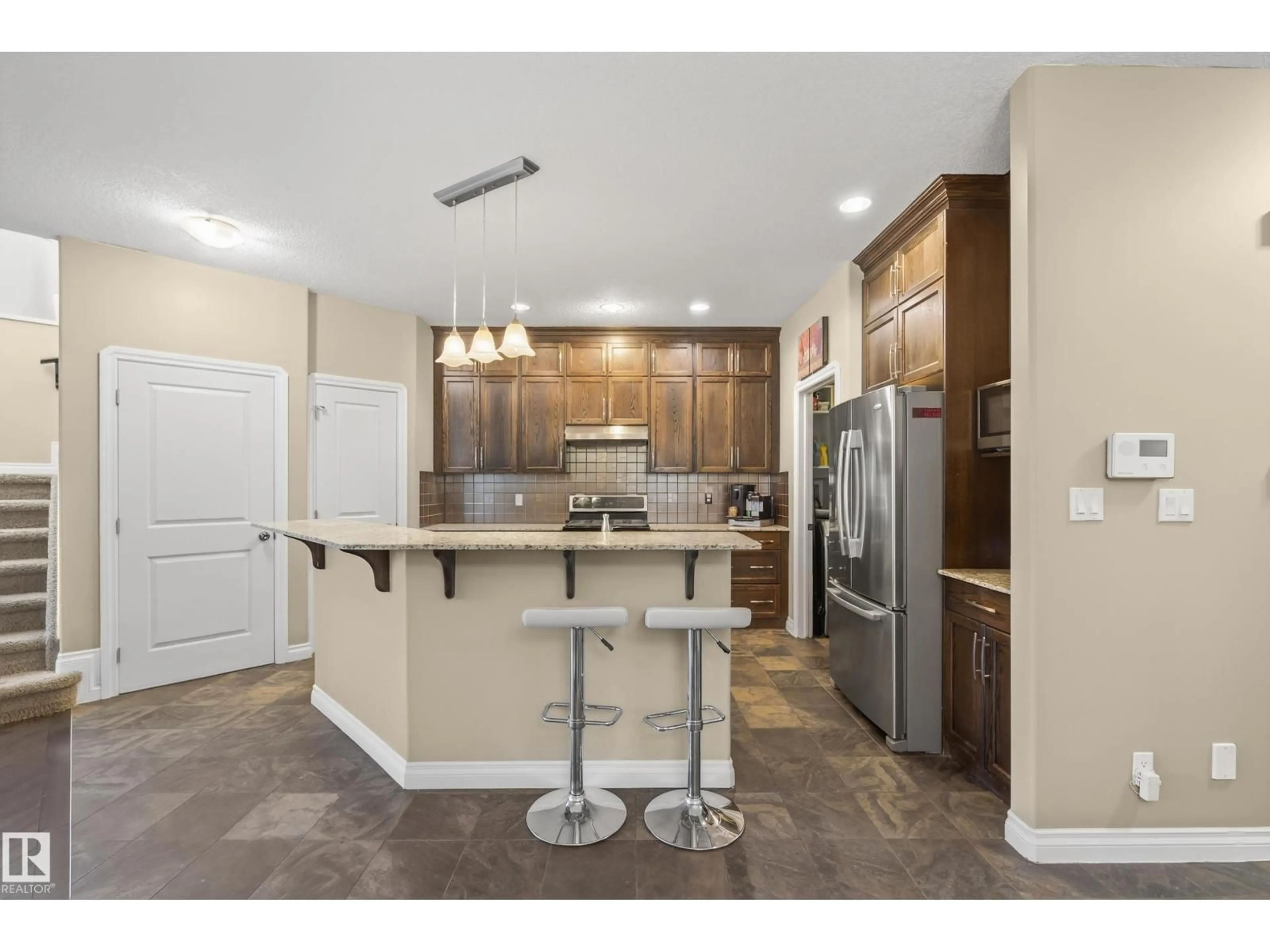 Open concept kitchen, ceramic/tile floor for 21917 95A AV, Edmonton Alberta T5T3Y6
