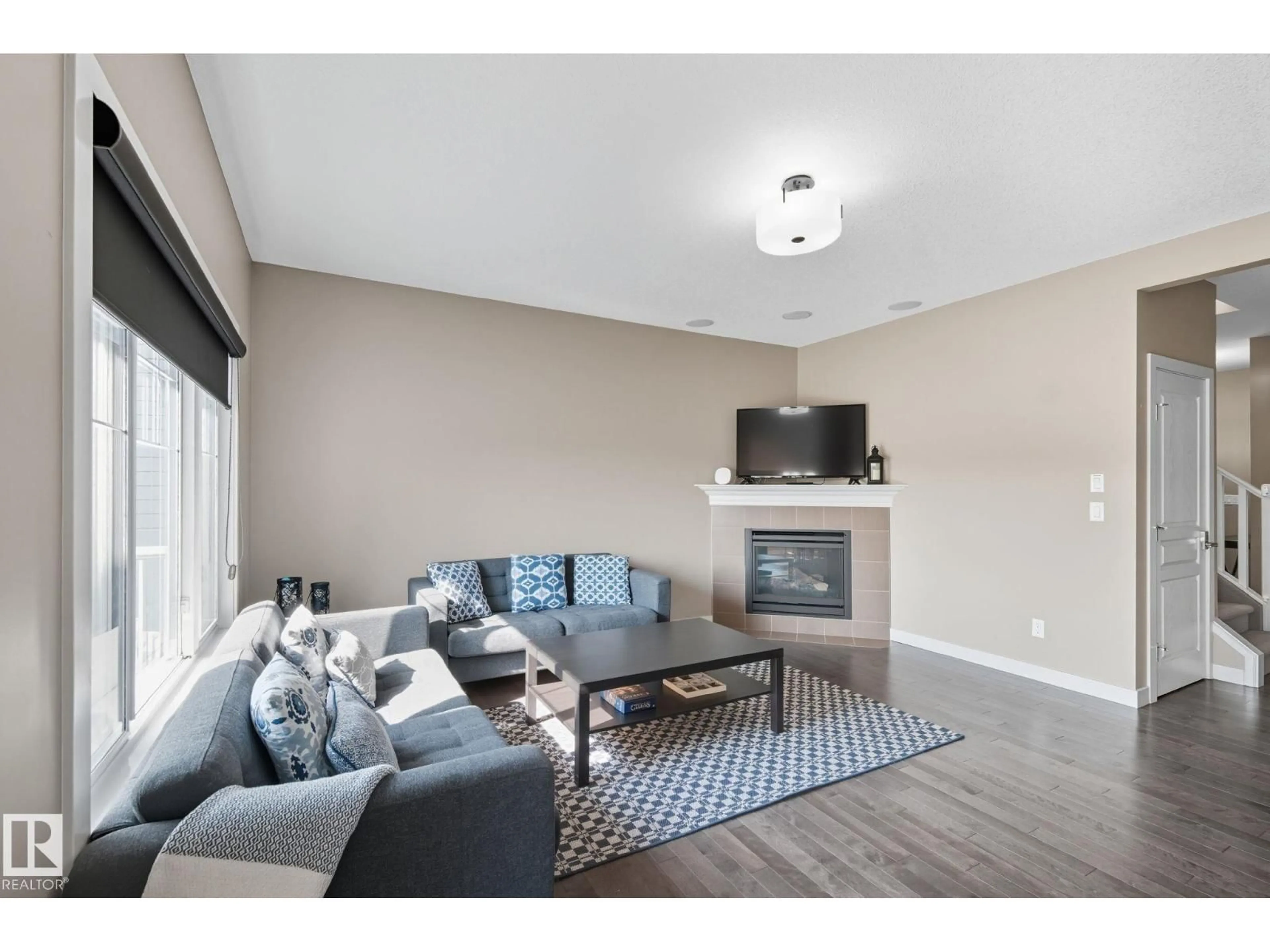 Living room with furniture, unknown for 8039 18 AV, Edmonton Alberta T6X0Z8