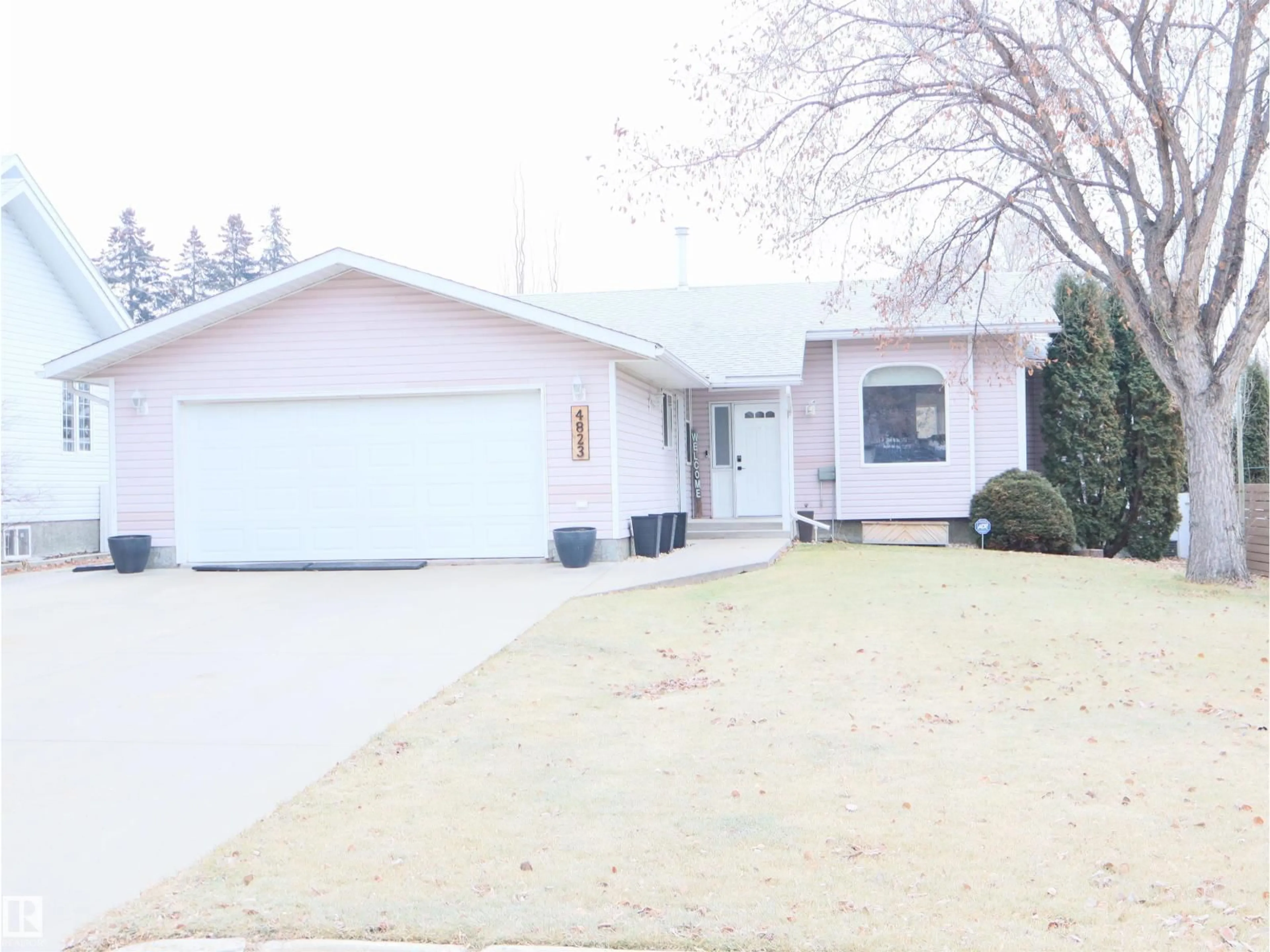 Home with vinyl exterior material, street for 4823 49A STREET, Barrhead Alberta T7N1G6