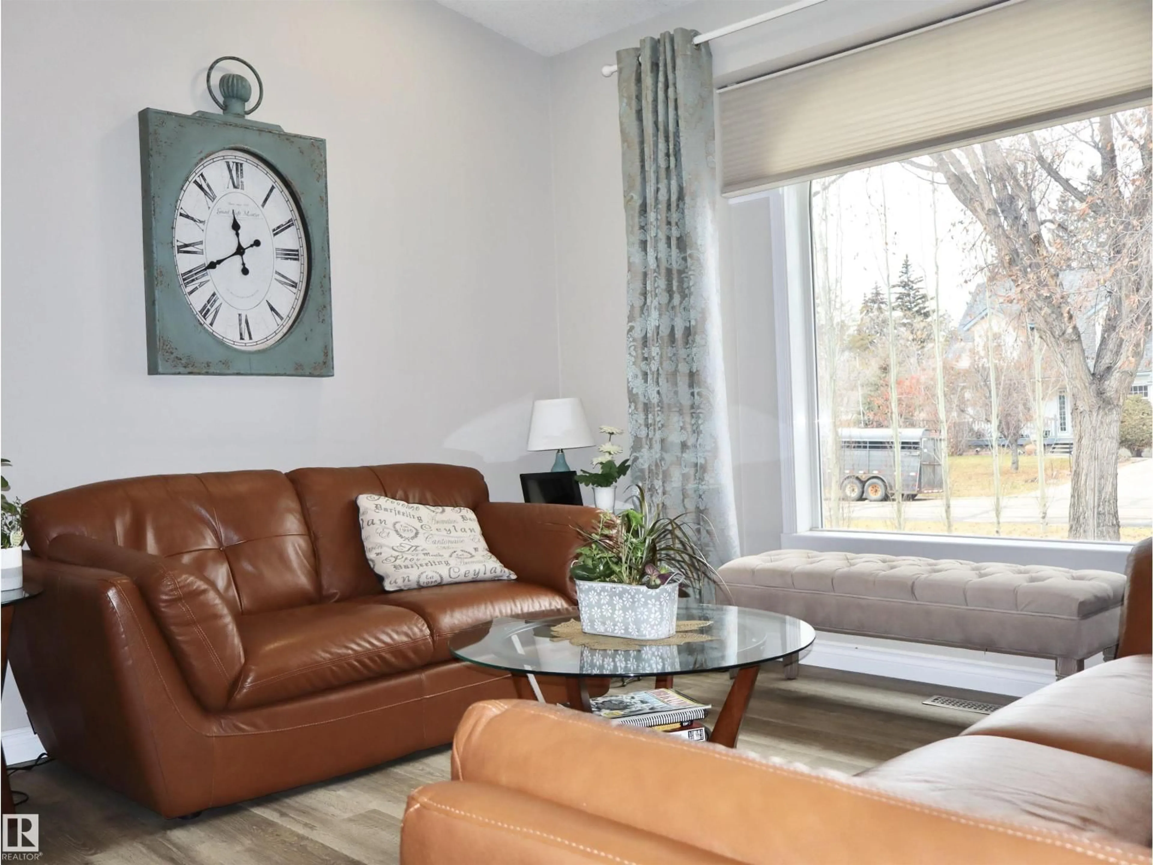 Living room with furniture, wood/laminate floor for 4823 49A STREET, Barrhead Alberta T7N1G6