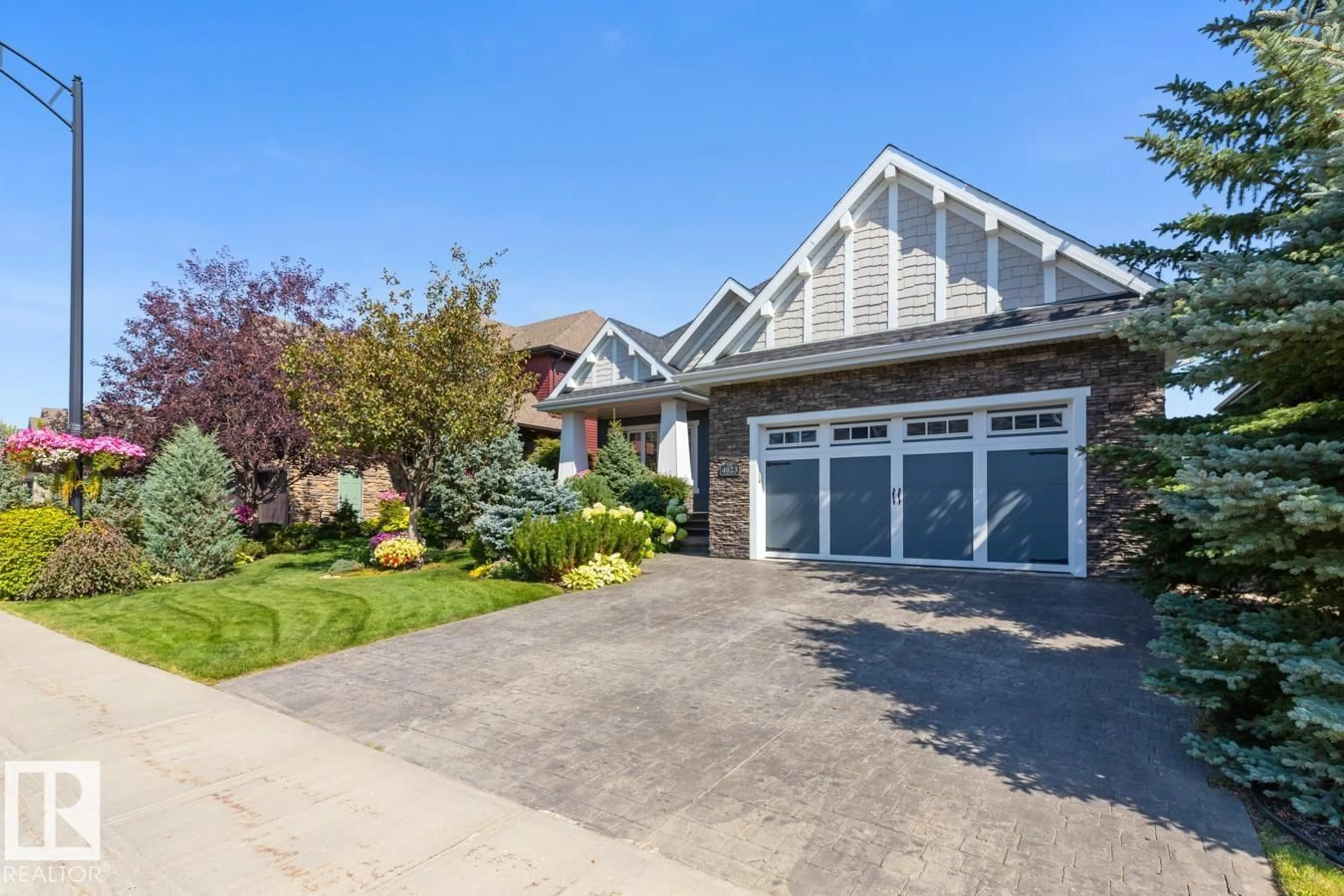 Home with vinyl exterior material, street for 4023 WHISPERING RIVER DR, Edmonton Alberta T6W0T5