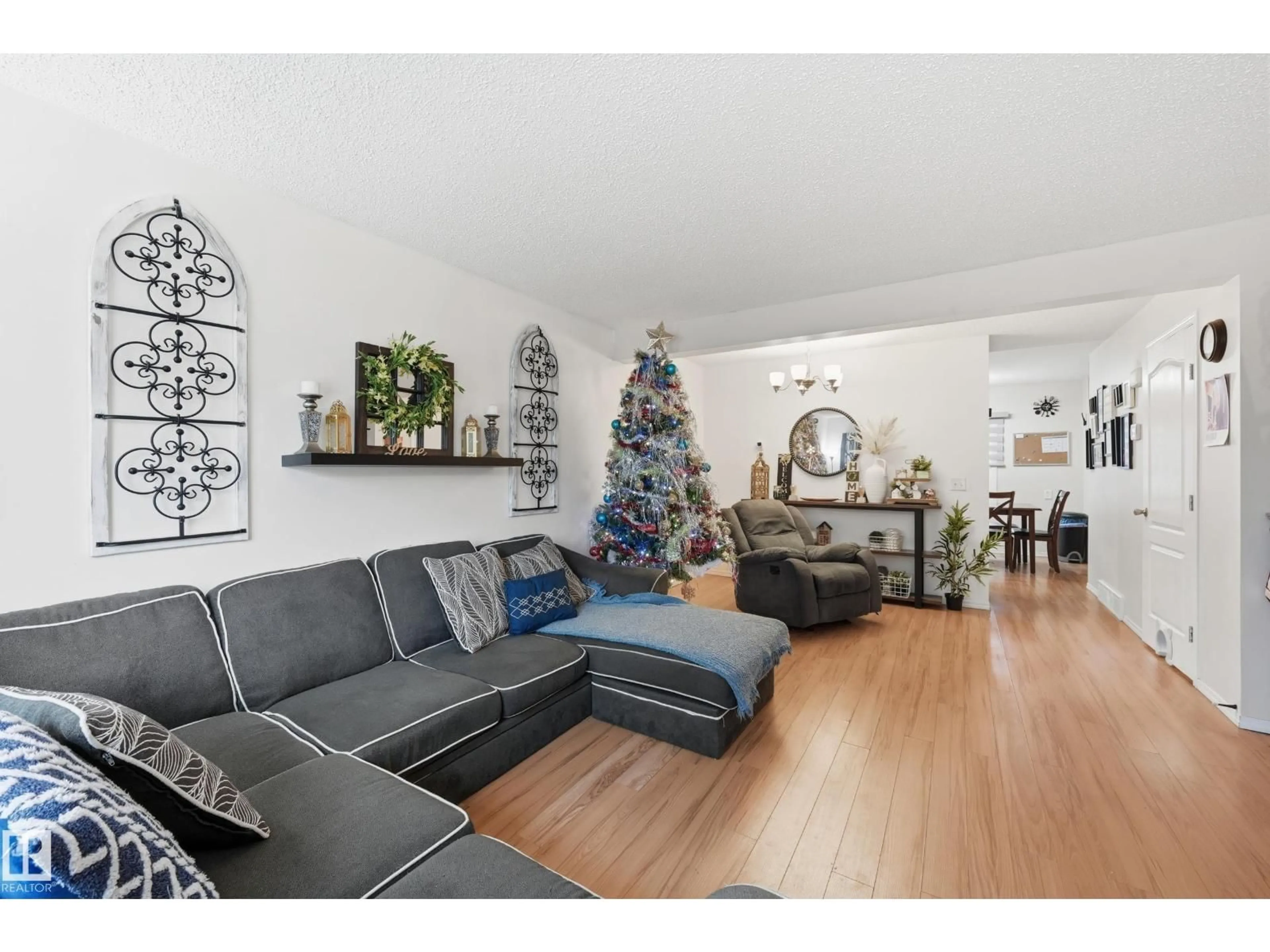 Living room with furniture, wood/laminate floor for 18423 95A AV, Edmonton Alberta T5T3V7