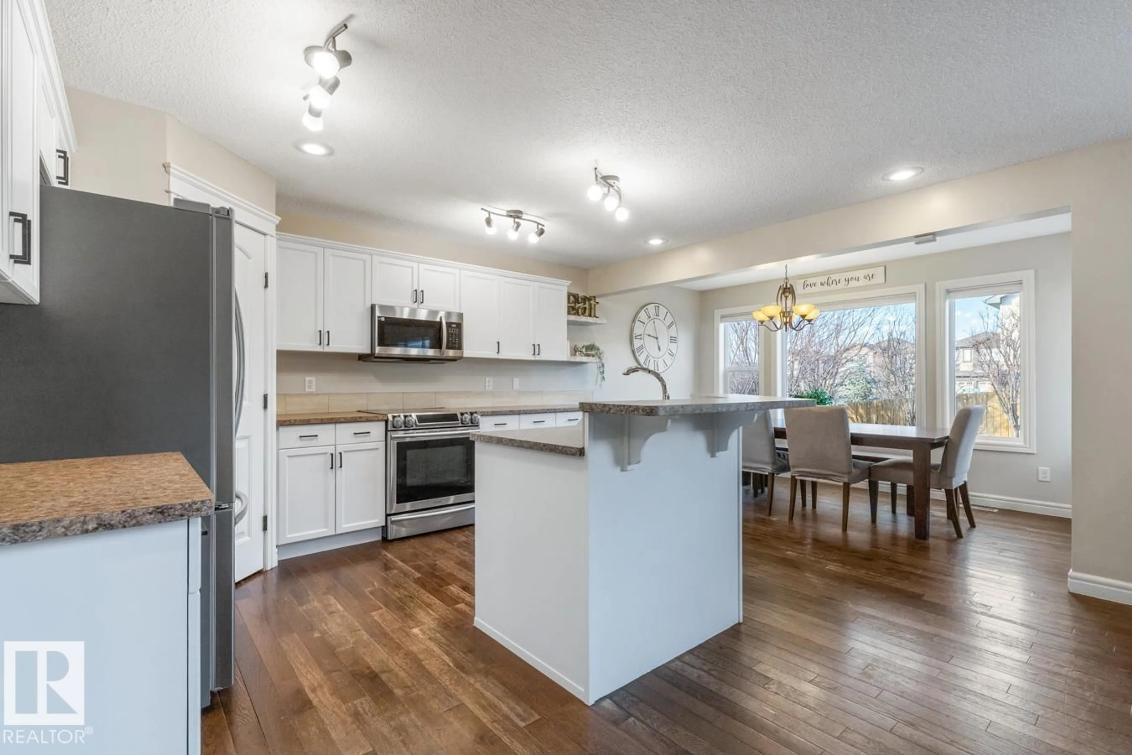 Open concept kitchen, wood/laminate floor for 2 SEQUOIA BN, Fort Saskatchewan Alberta T8L0J2