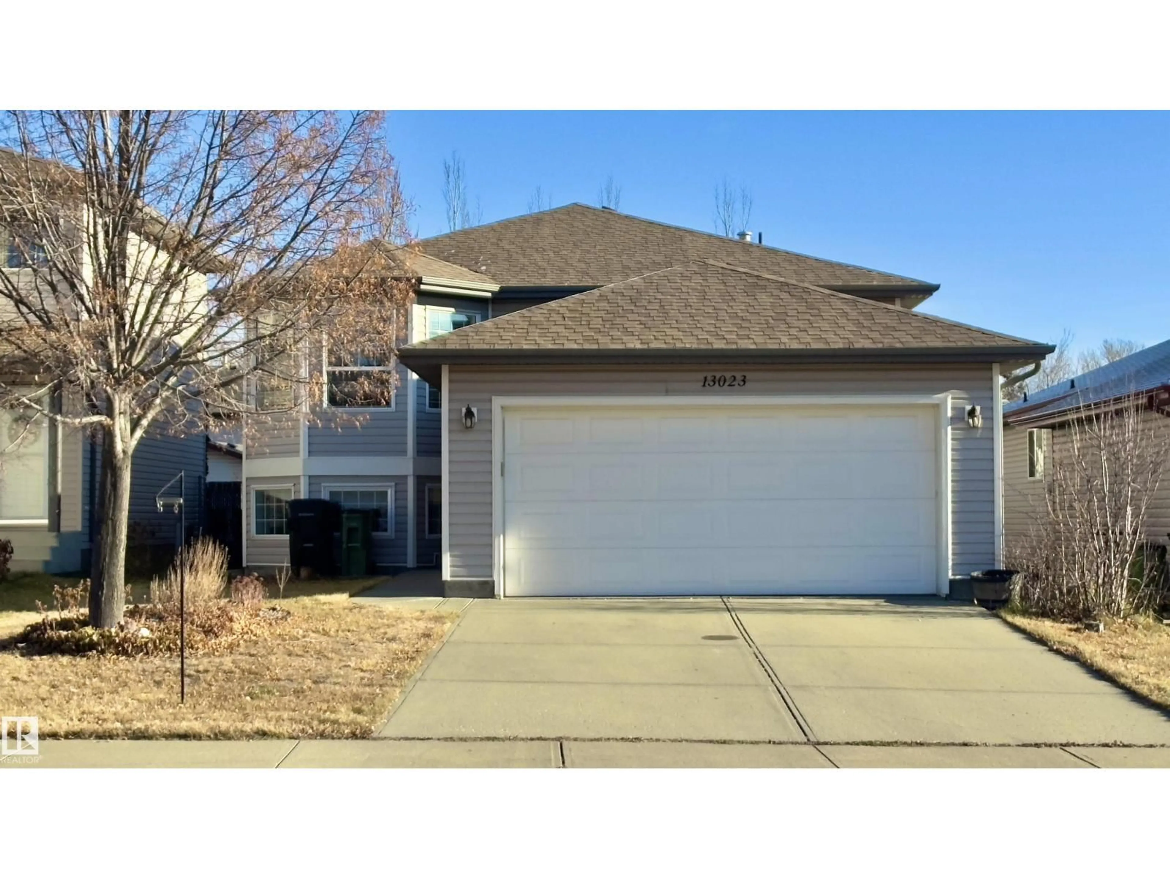 Home with vinyl exterior material, street for NW - 13023 35 ST, Edmonton Alberta T5A5C8