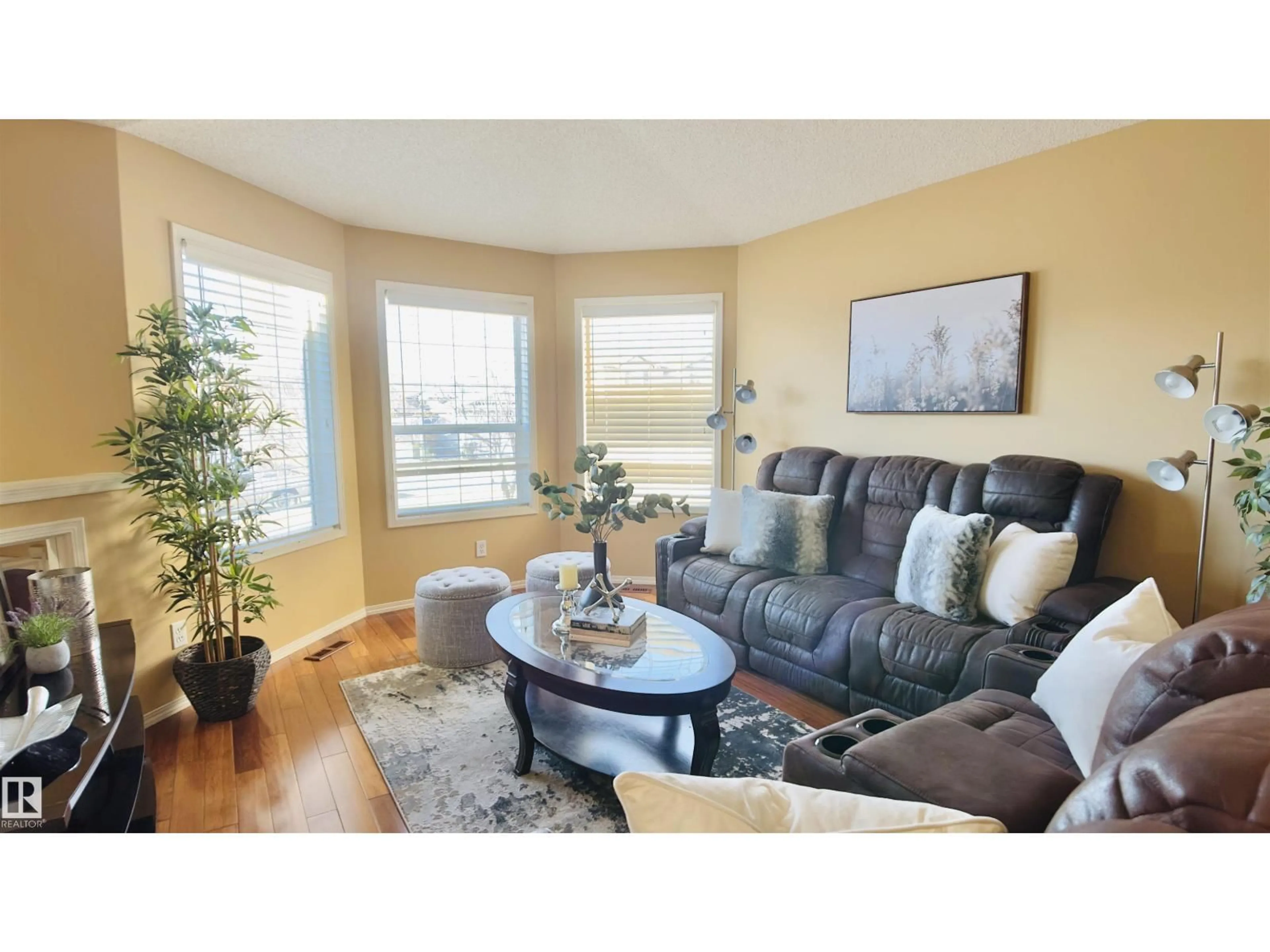 Living room with furniture, wood/laminate floor for NW - 13023 35 ST, Edmonton Alberta T5A5C8