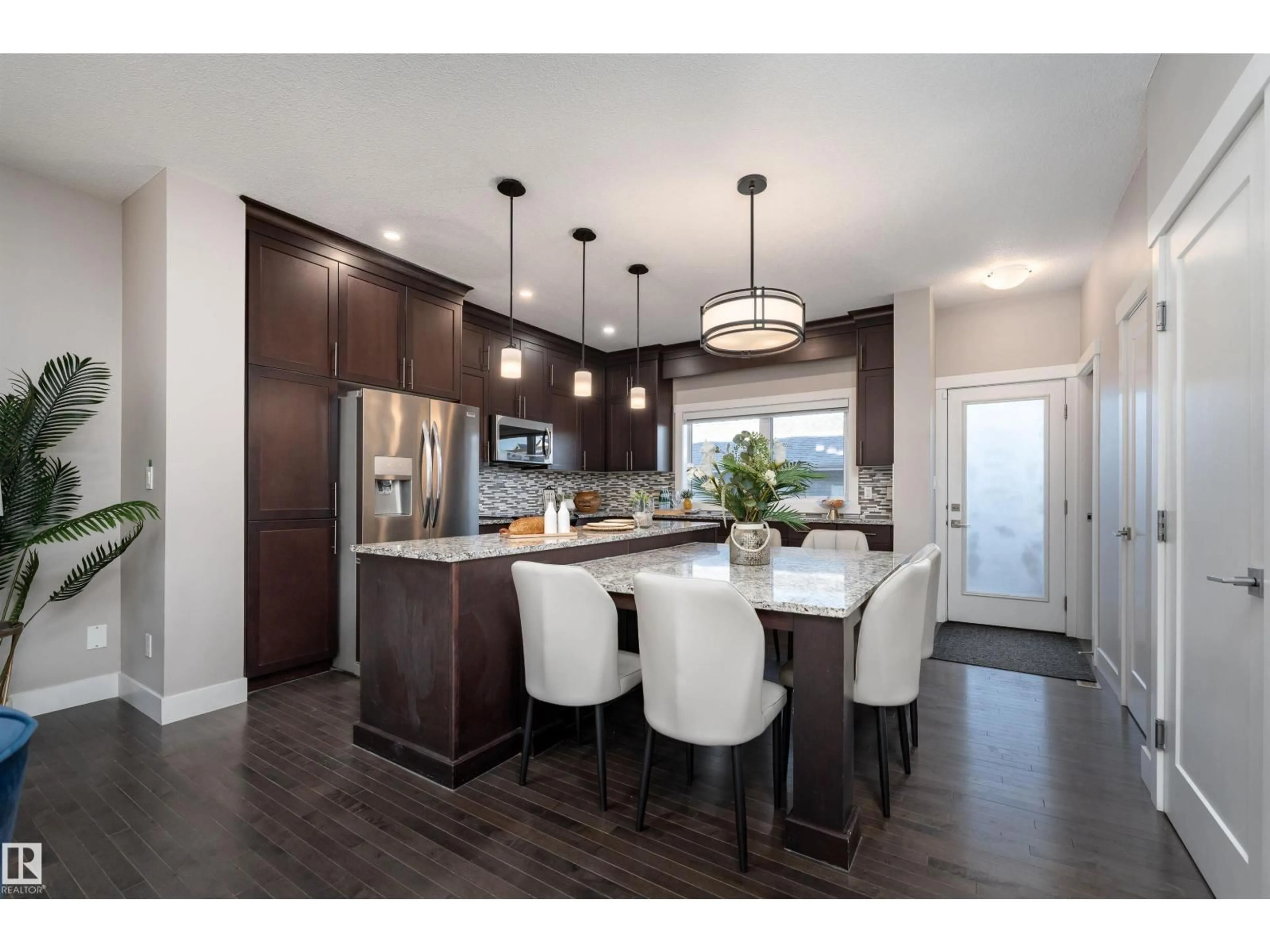 Open concept kitchen, wood/laminate floor for 388 ALLARD BV, Edmonton Alberta T6W3T6