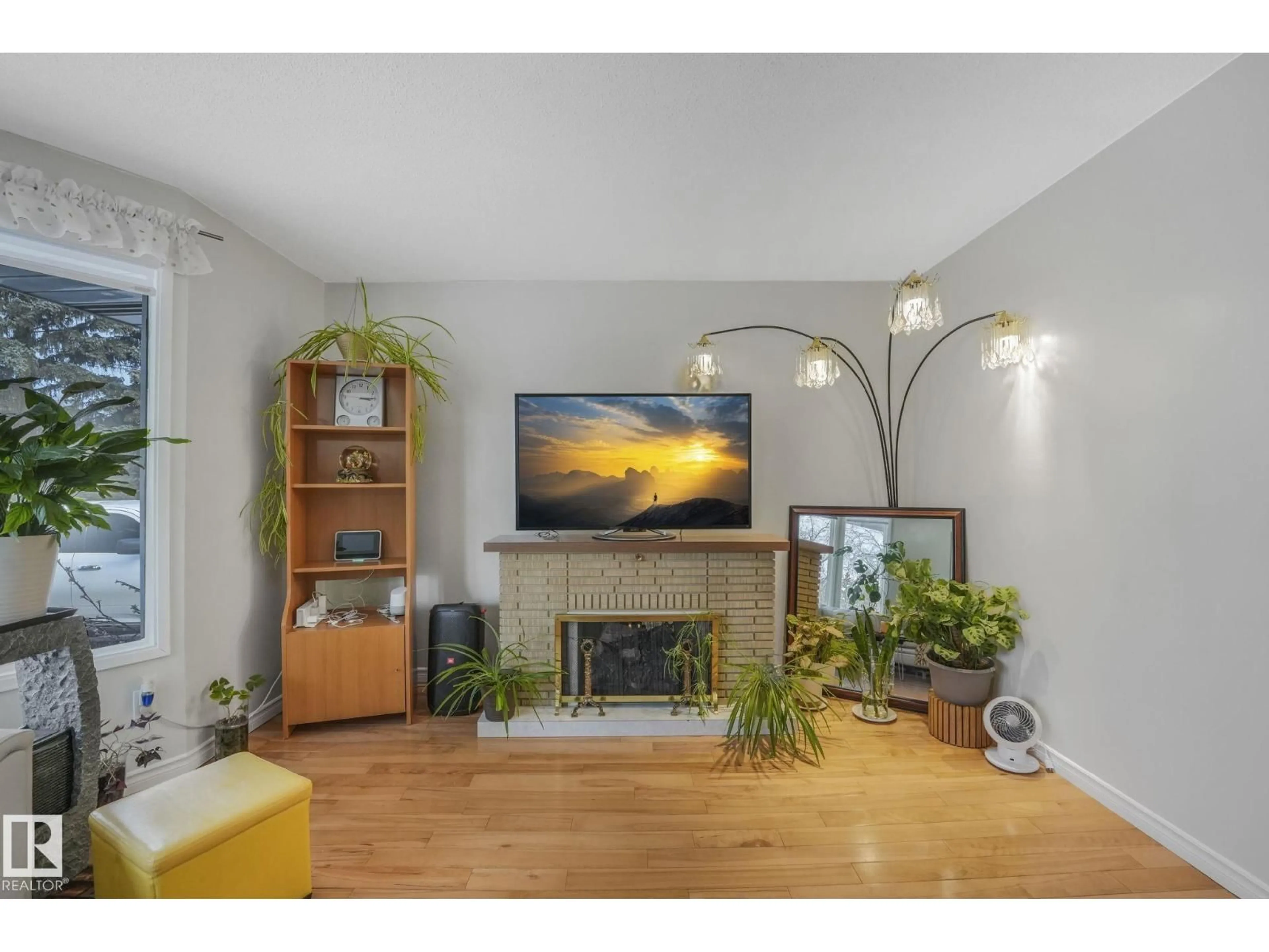 Living room with furniture, wood/laminate floor for 5107 56 AV, Leduc Alberta T9E5N3