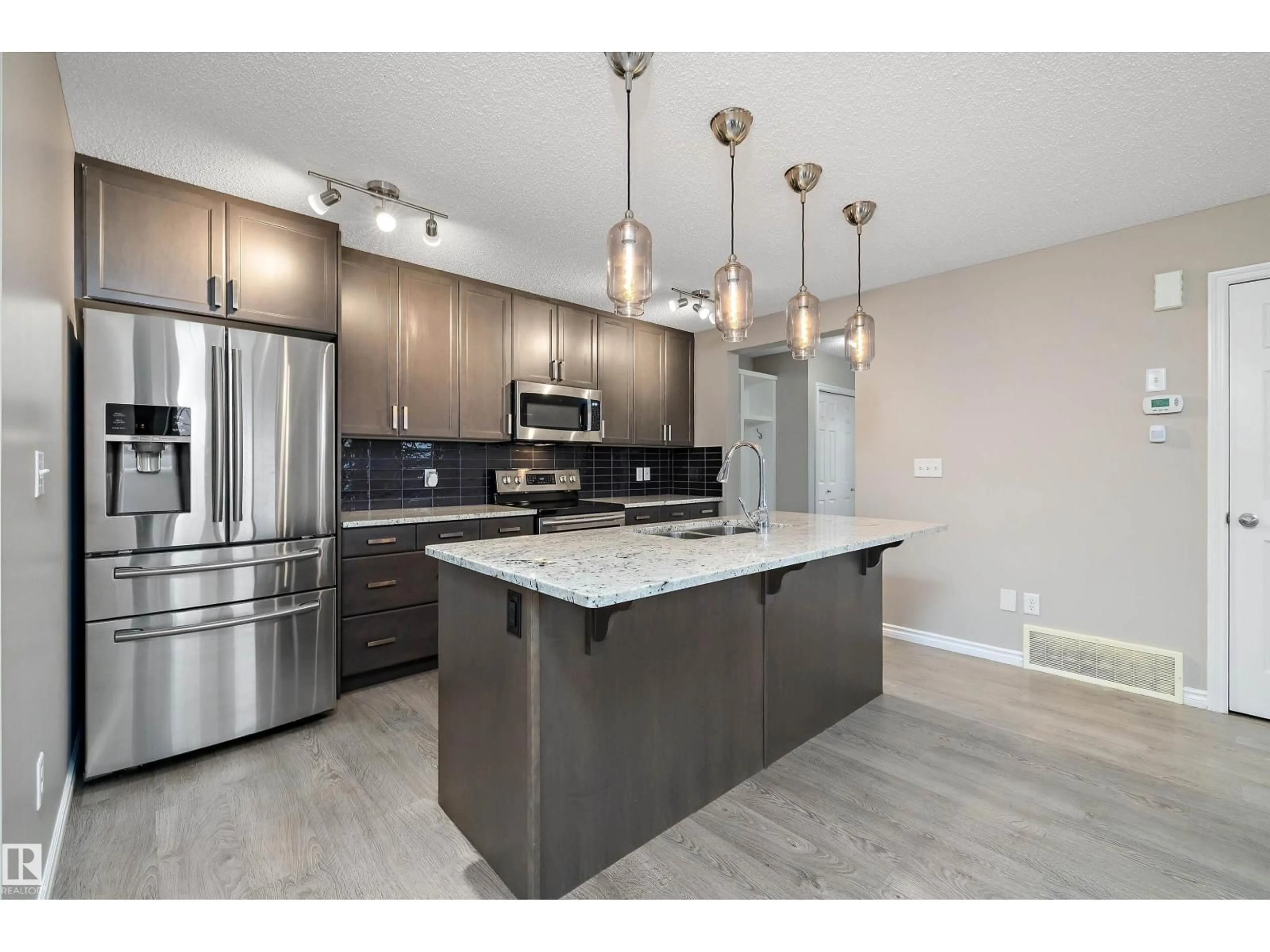 Open concept kitchen, unknown for 29175 91 AV, Edmonton Alberta T5T6Z8