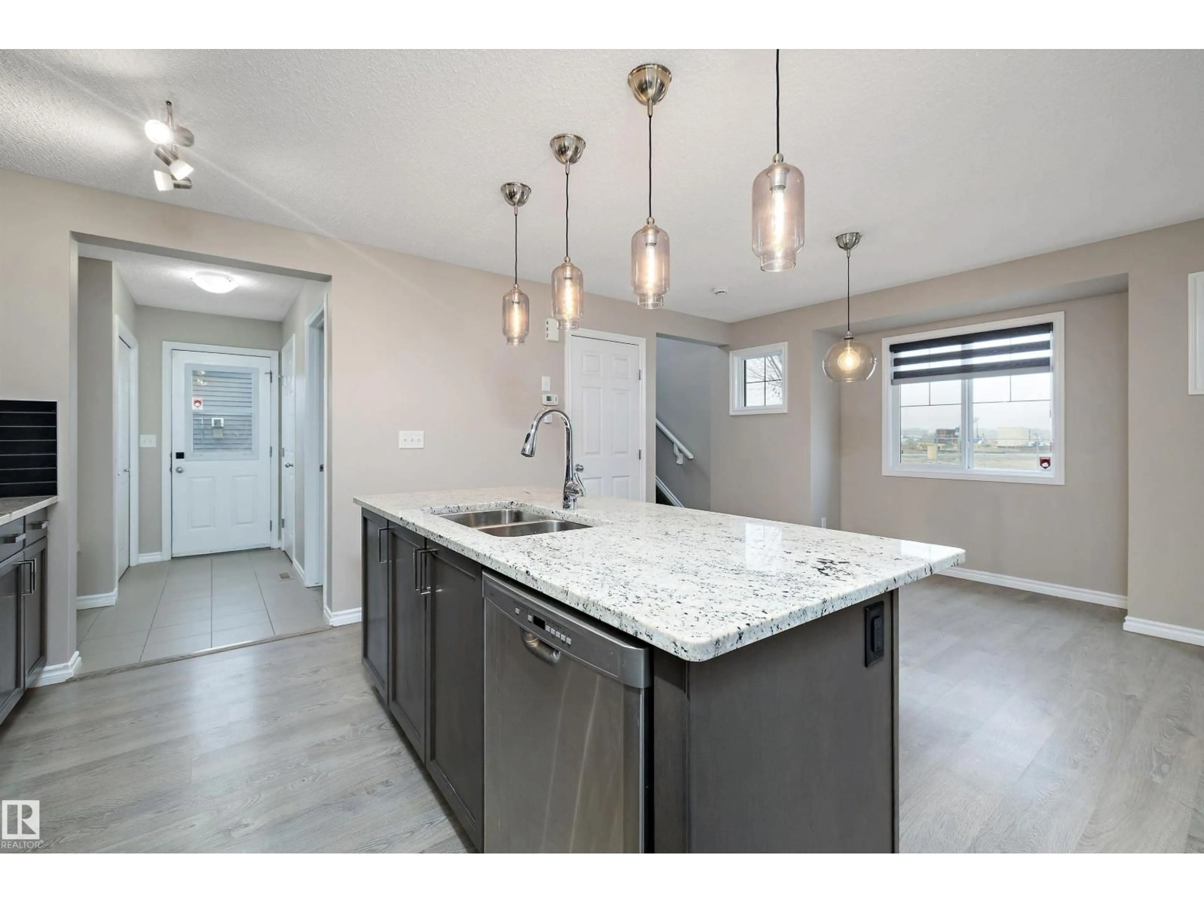 Open concept kitchen, ceramic/tile floor for 29175 91 AV, Edmonton Alberta T5T6Z8