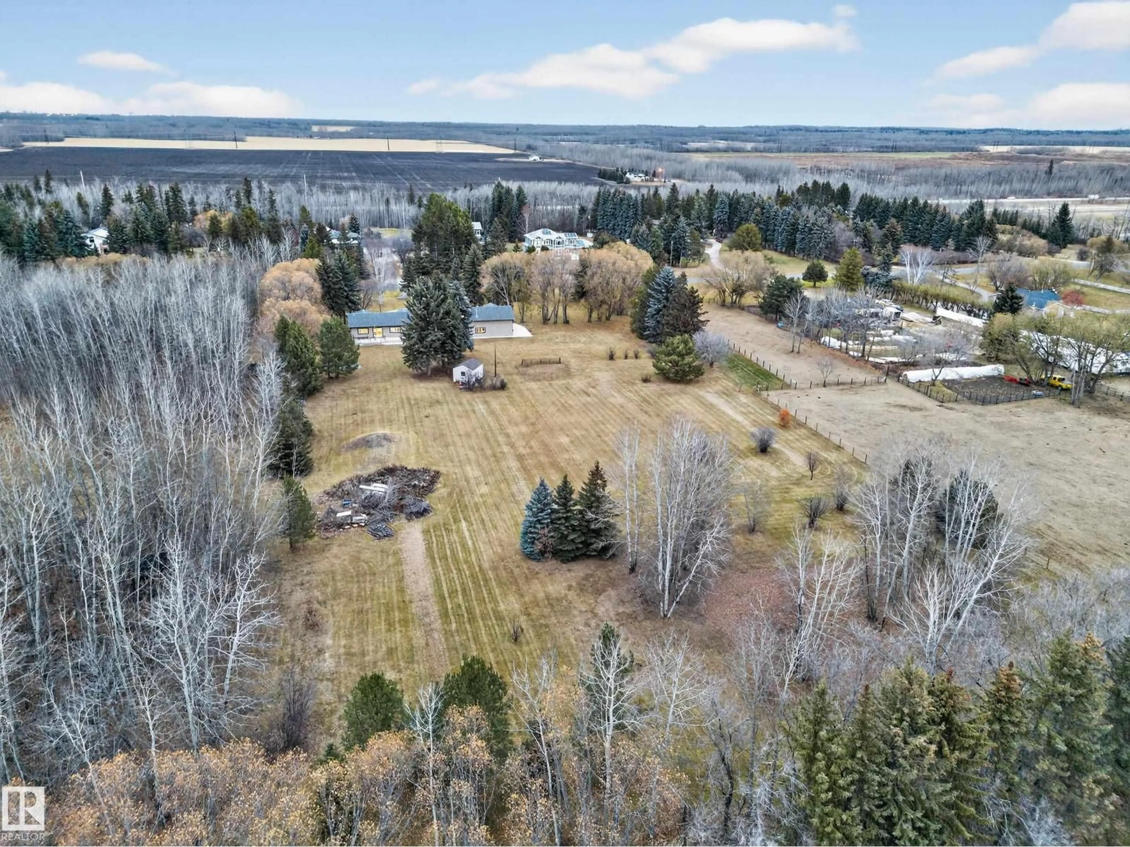 A pic from outside/outdoor area/front of a property/back of a property/a pic from drone, water/lake/river/ocean view for 37 - 51528 RGE ROAD 262, Rural Parkland County Alberta T7Y1C1