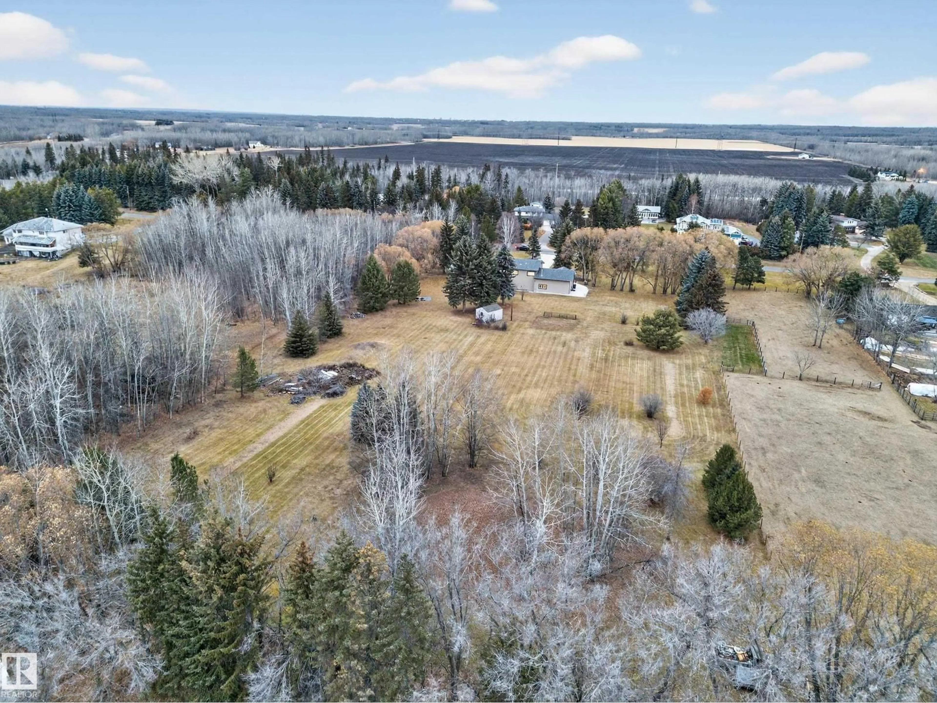 A pic from outside/outdoor area/front of a property/back of a property/a pic from drone, forest/trees view for 37 - 51528 RGE ROAD 262, Rural Parkland County Alberta T7Y1C1