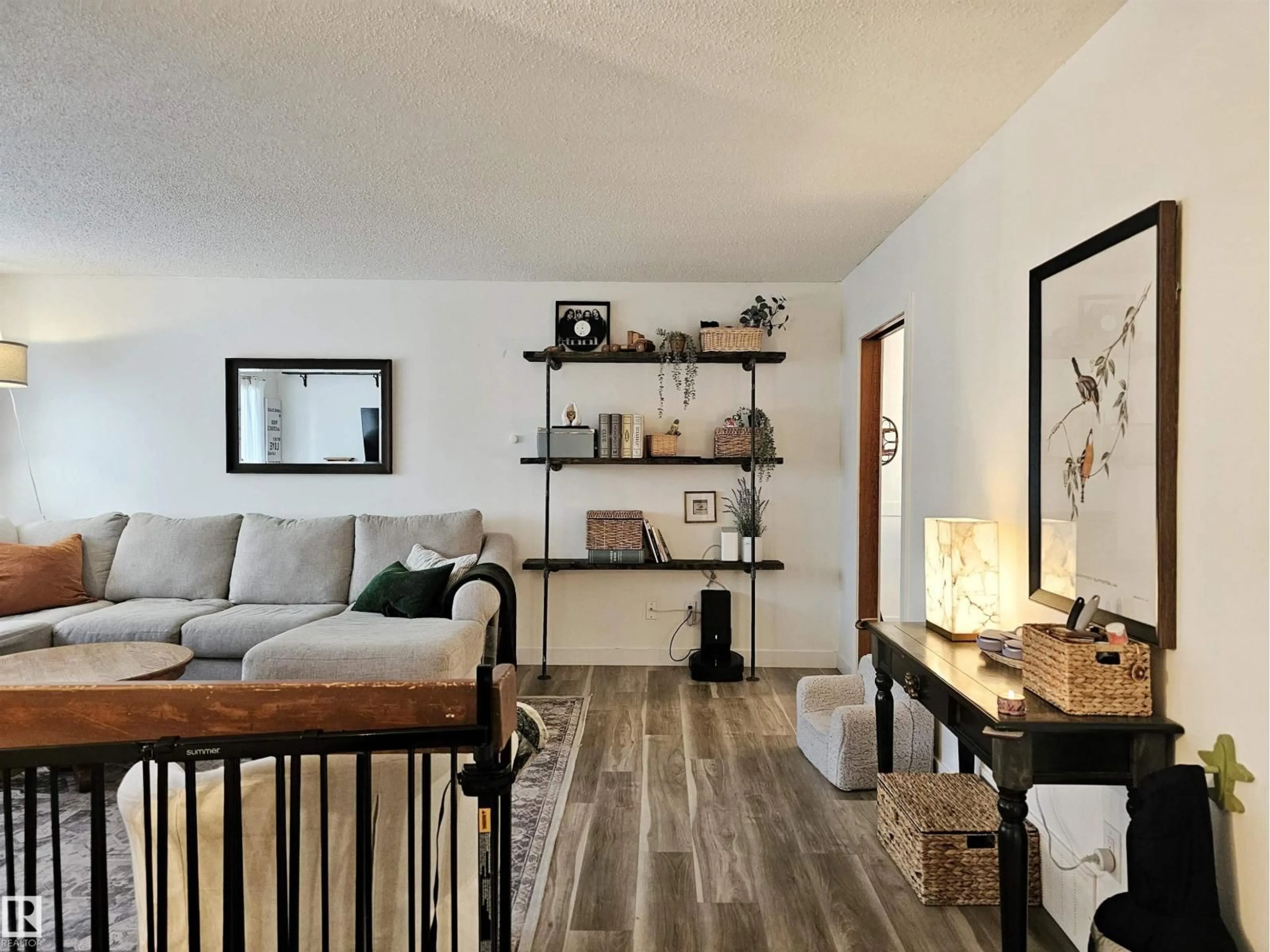 Living room with furniture, wood/laminate floor for NW - 127 GRAND MEADOW CR, Edmonton Alberta T6L1X1