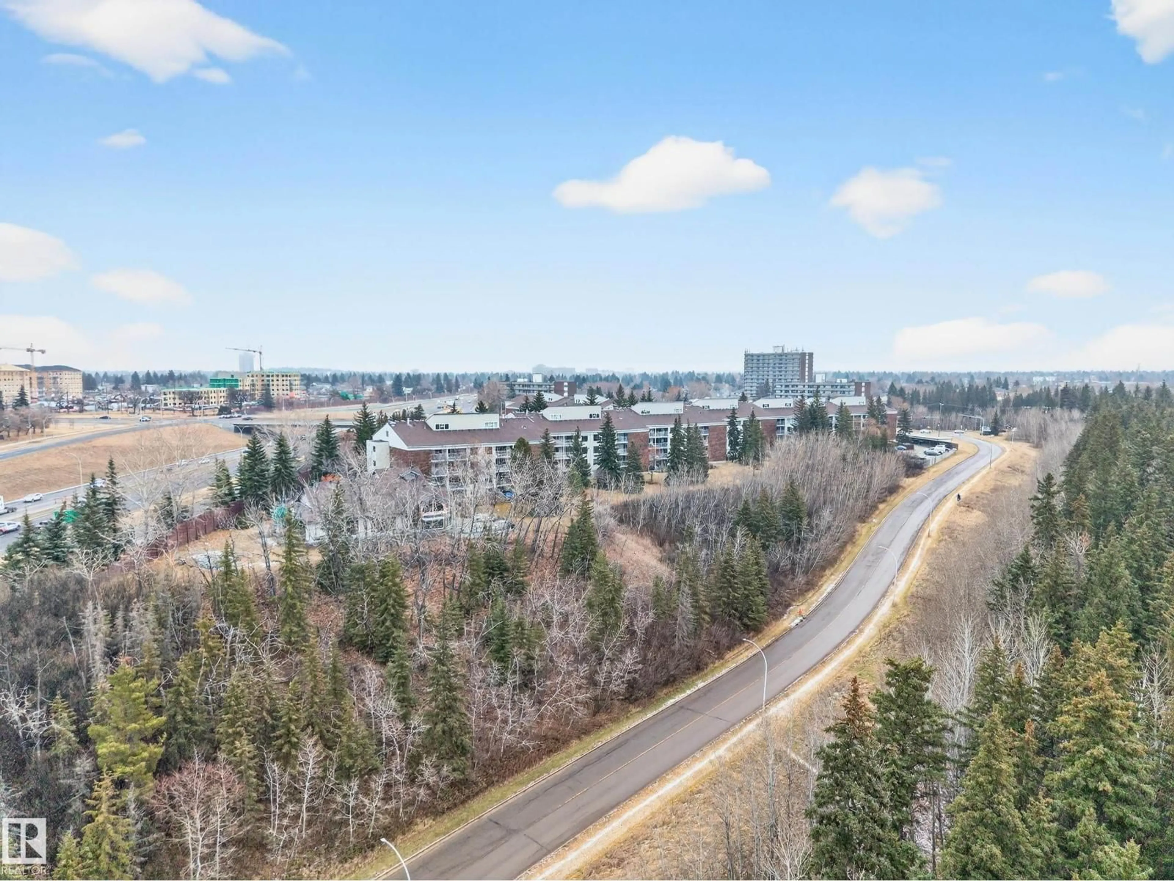 A pic from outside/outdoor area/front of a property/back of a property/a pic from drone, mountain view for 429 - 4404 122 ST, Edmonton Alberta T6J4A9