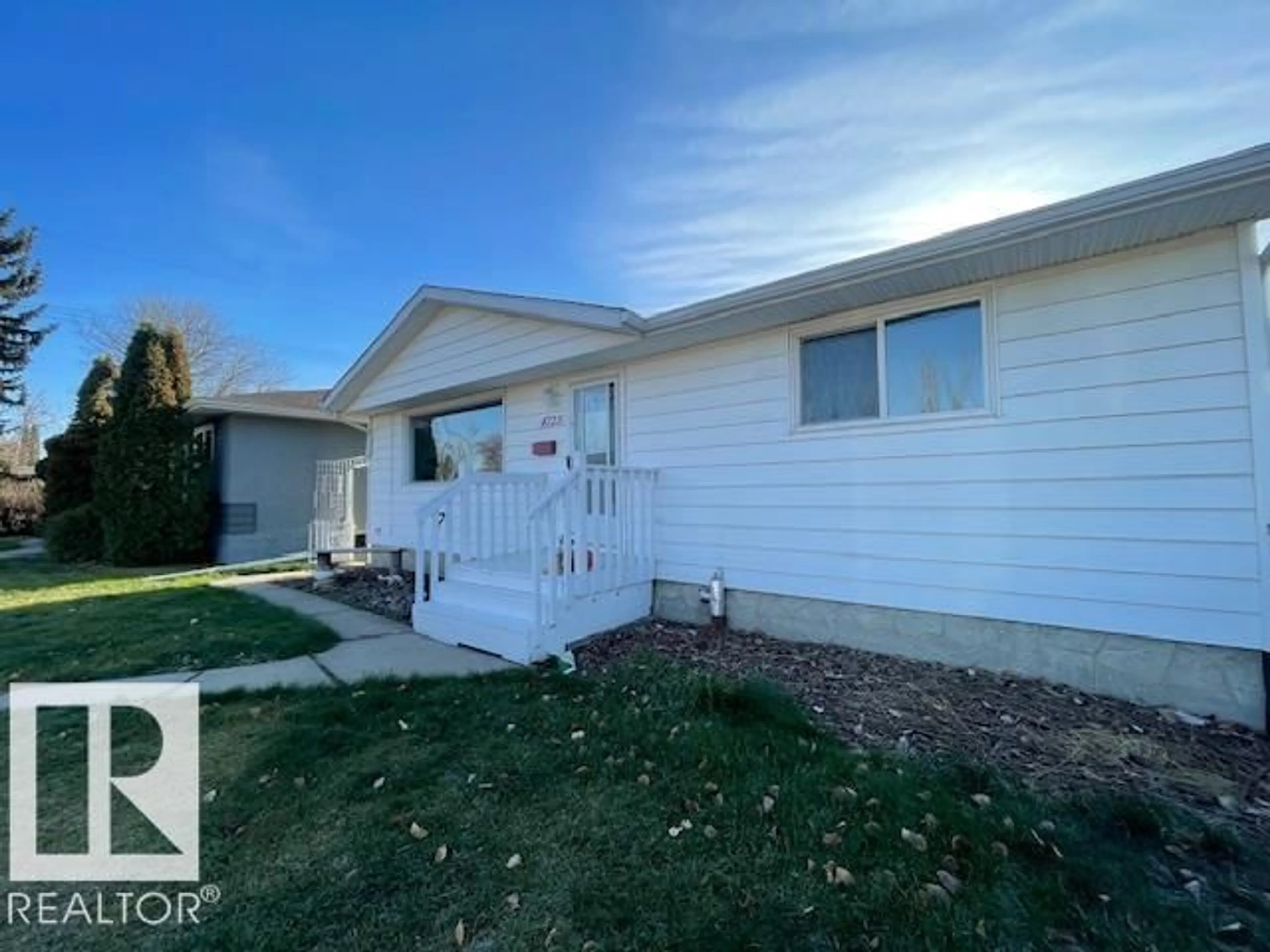 Home with vinyl exterior material, street for 4723 103 AV, Edmonton Alberta T6A0S8