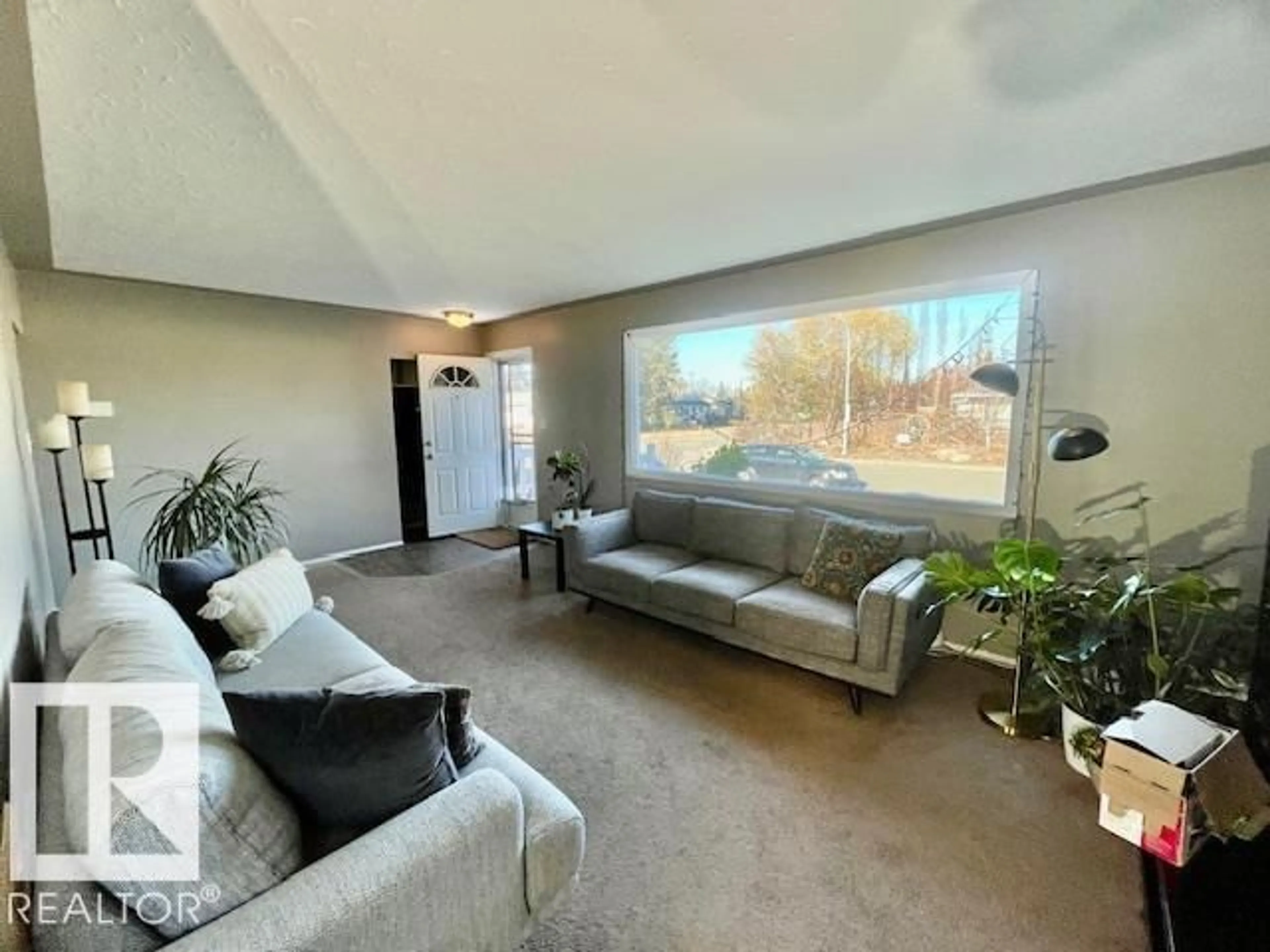 Living room with furniture, unknown for 4723 103 AV, Edmonton Alberta T6A0S8