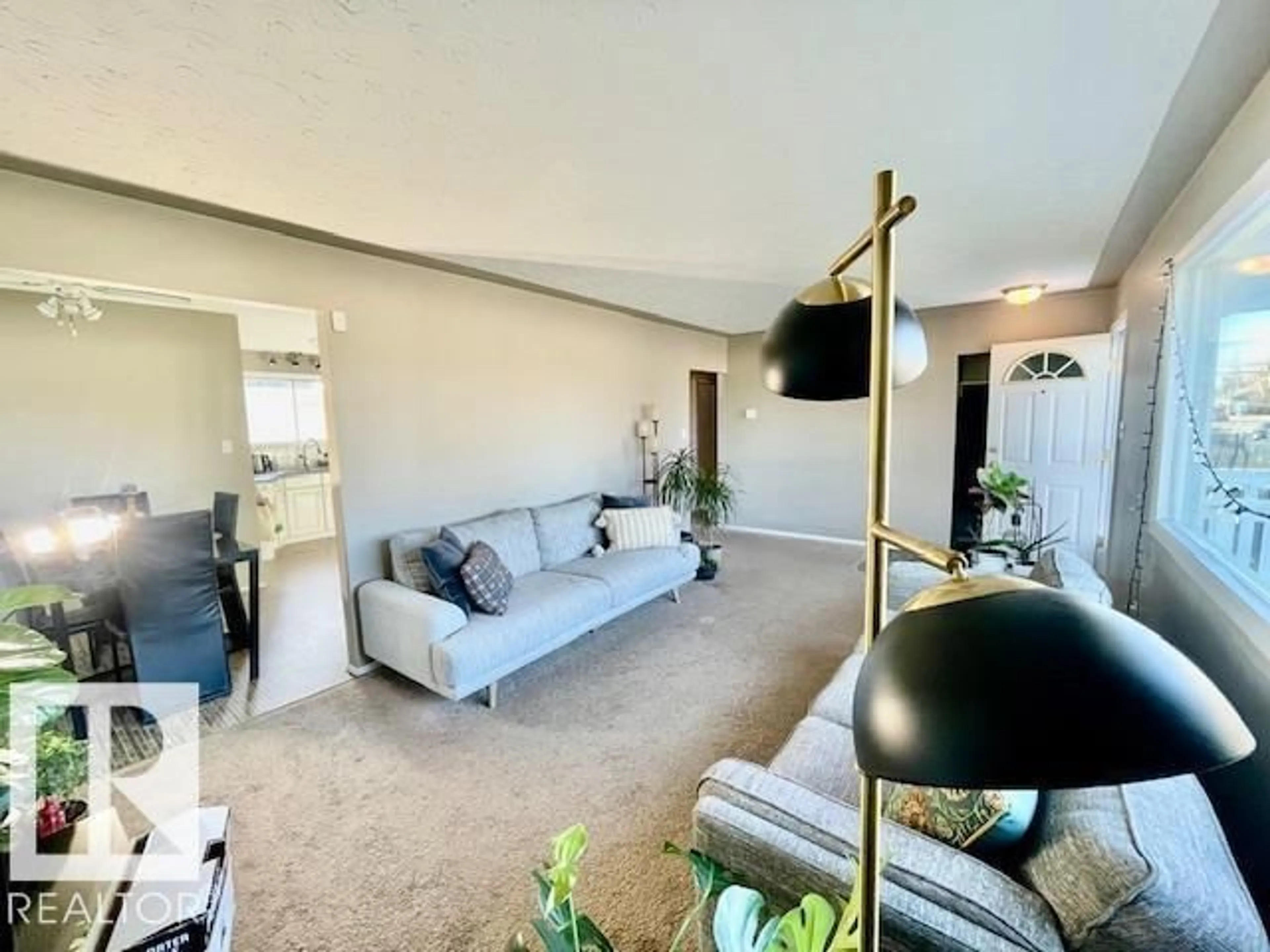 Living room with furniture, unknown for 4723 103 AV, Edmonton Alberta T6A0S8