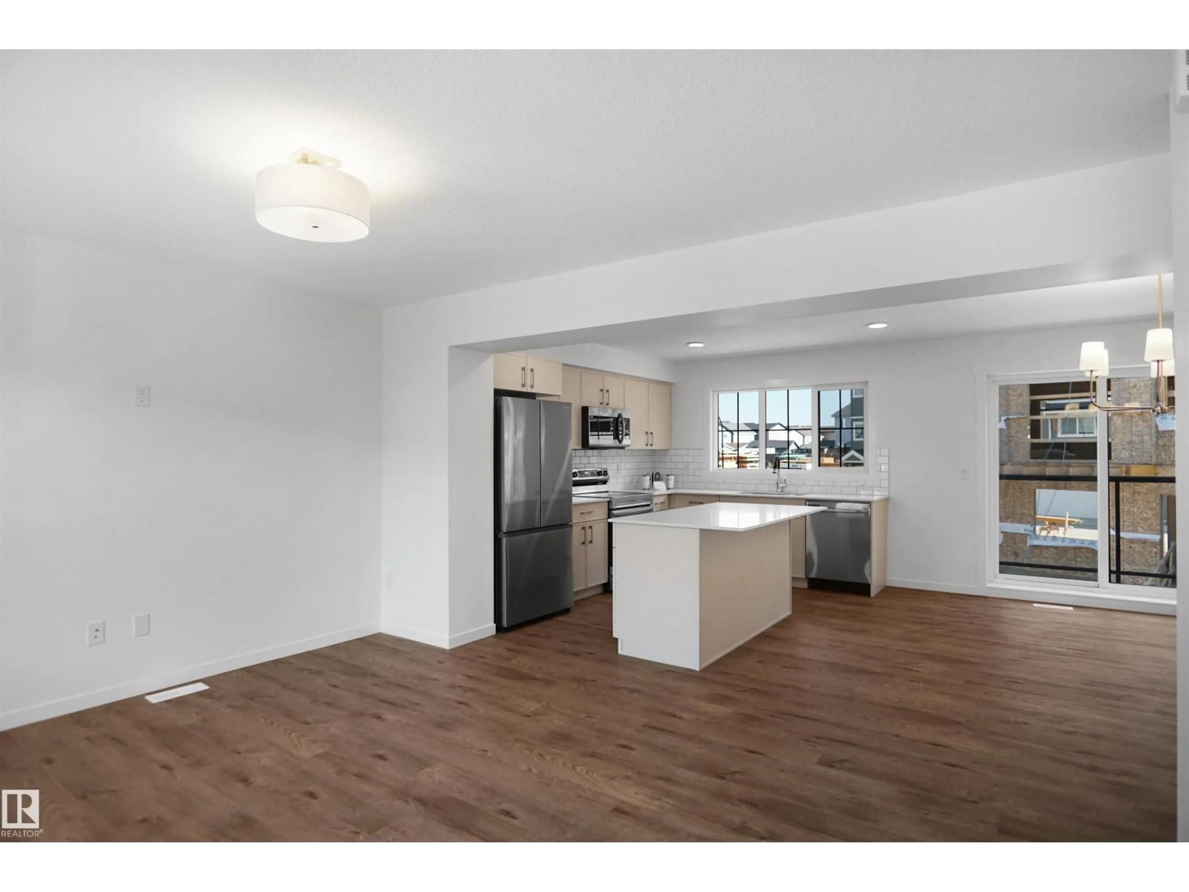 Open concept kitchen, wood/laminate floor for #71 - 17319 5 ST, Edmonton Alberta T5Y4G1