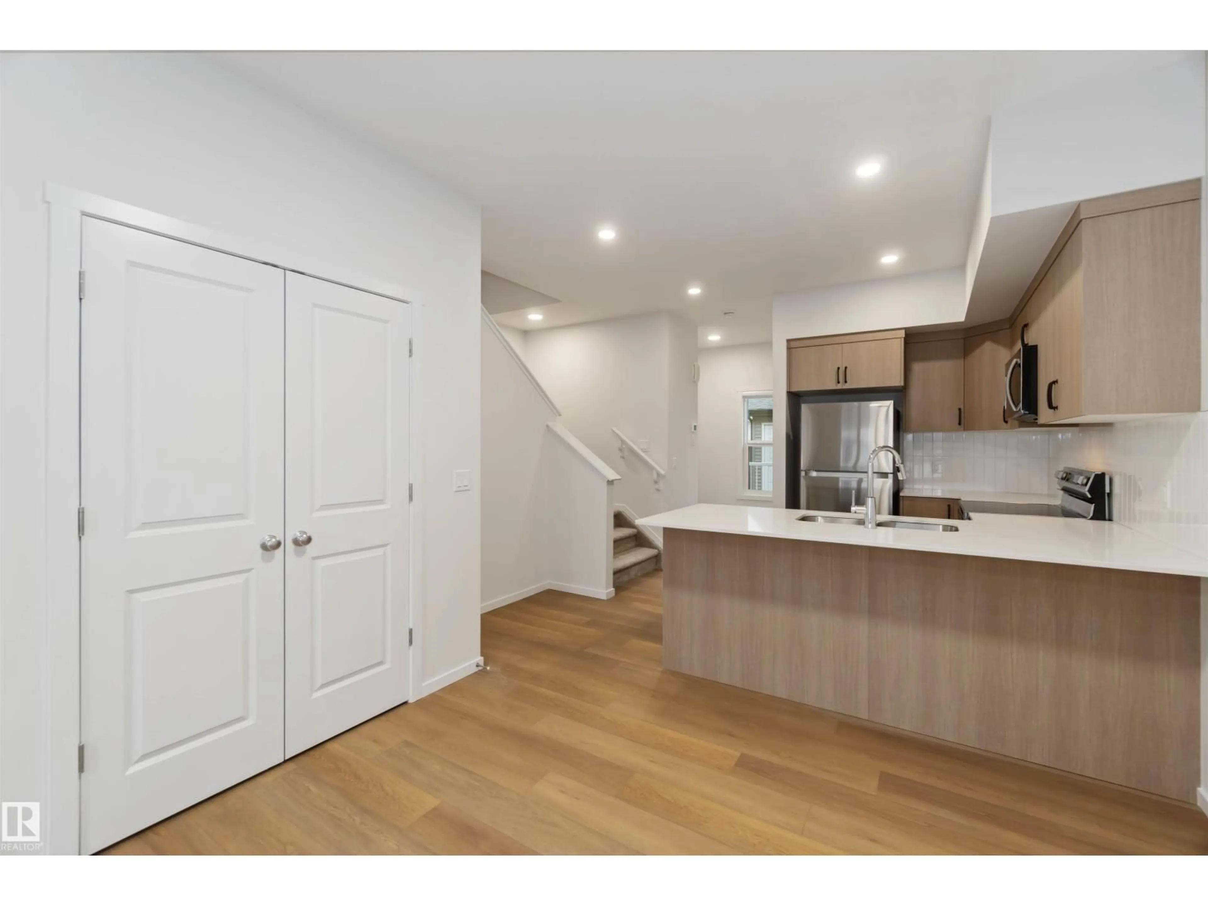 Open concept kitchen, wood/laminate floor for 4275 KINGLET DR, Edmonton Alberta T5S0W1