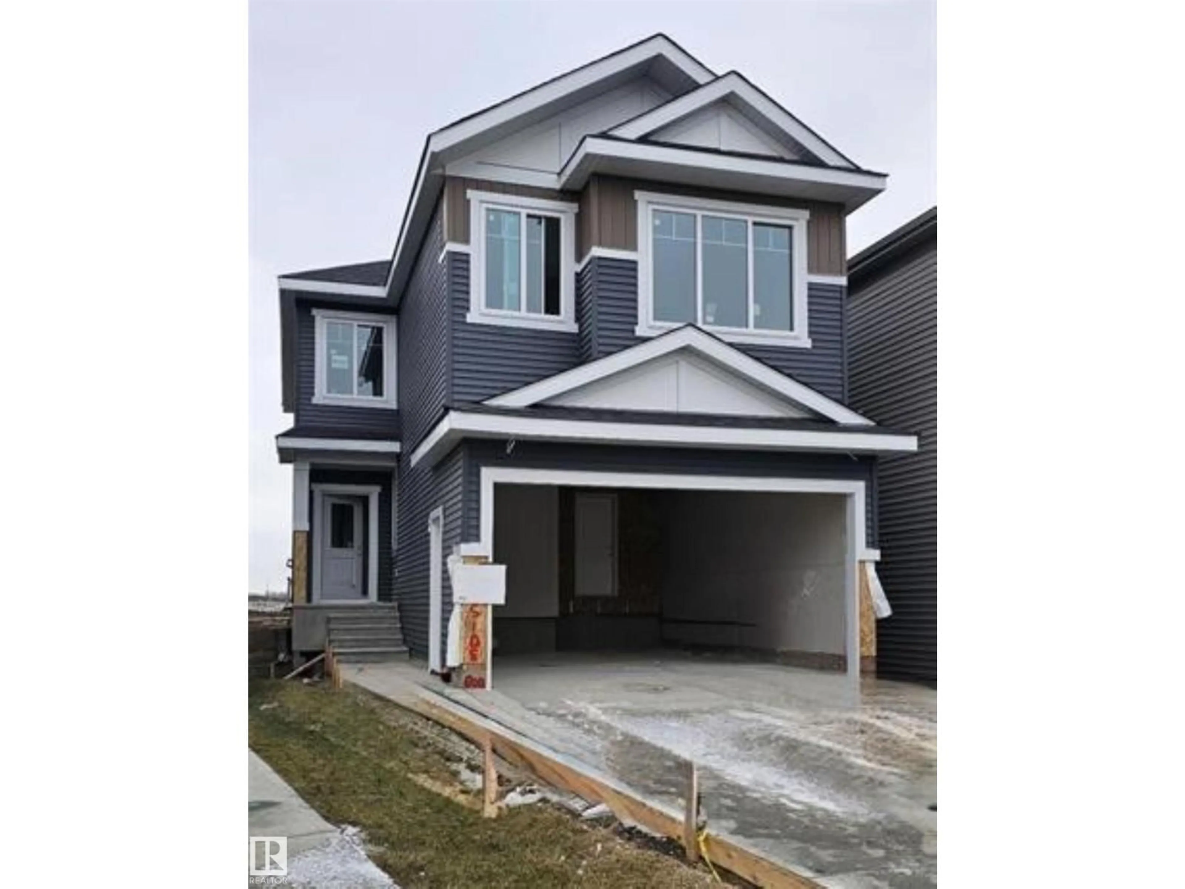 Home with vinyl exterior material, street for NW - 2408 208 ST, Edmonton Alberta T6M2J7