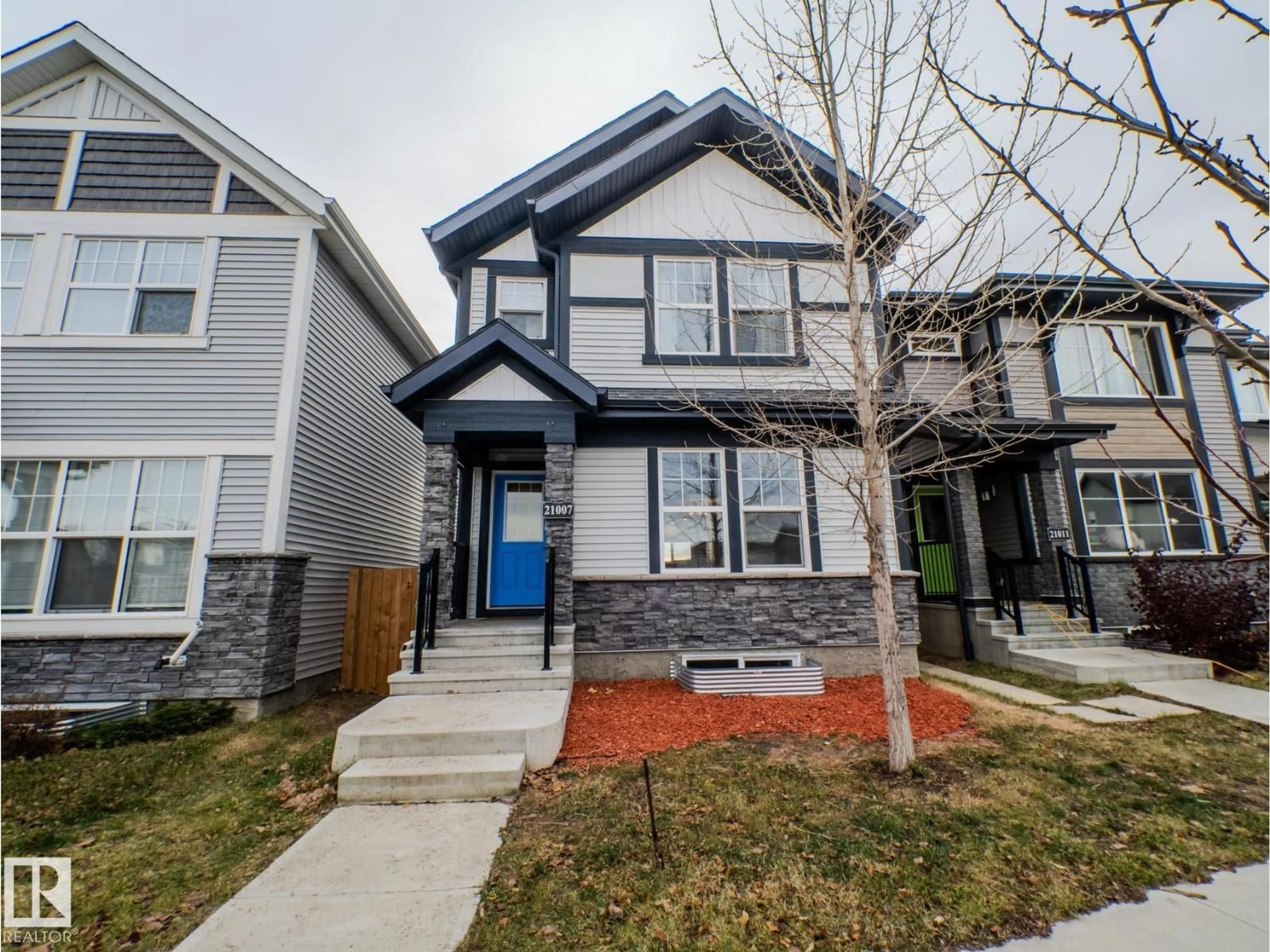 Home with vinyl exterior material, street for 21007 130 AV, Edmonton Alberta T5S0L4
