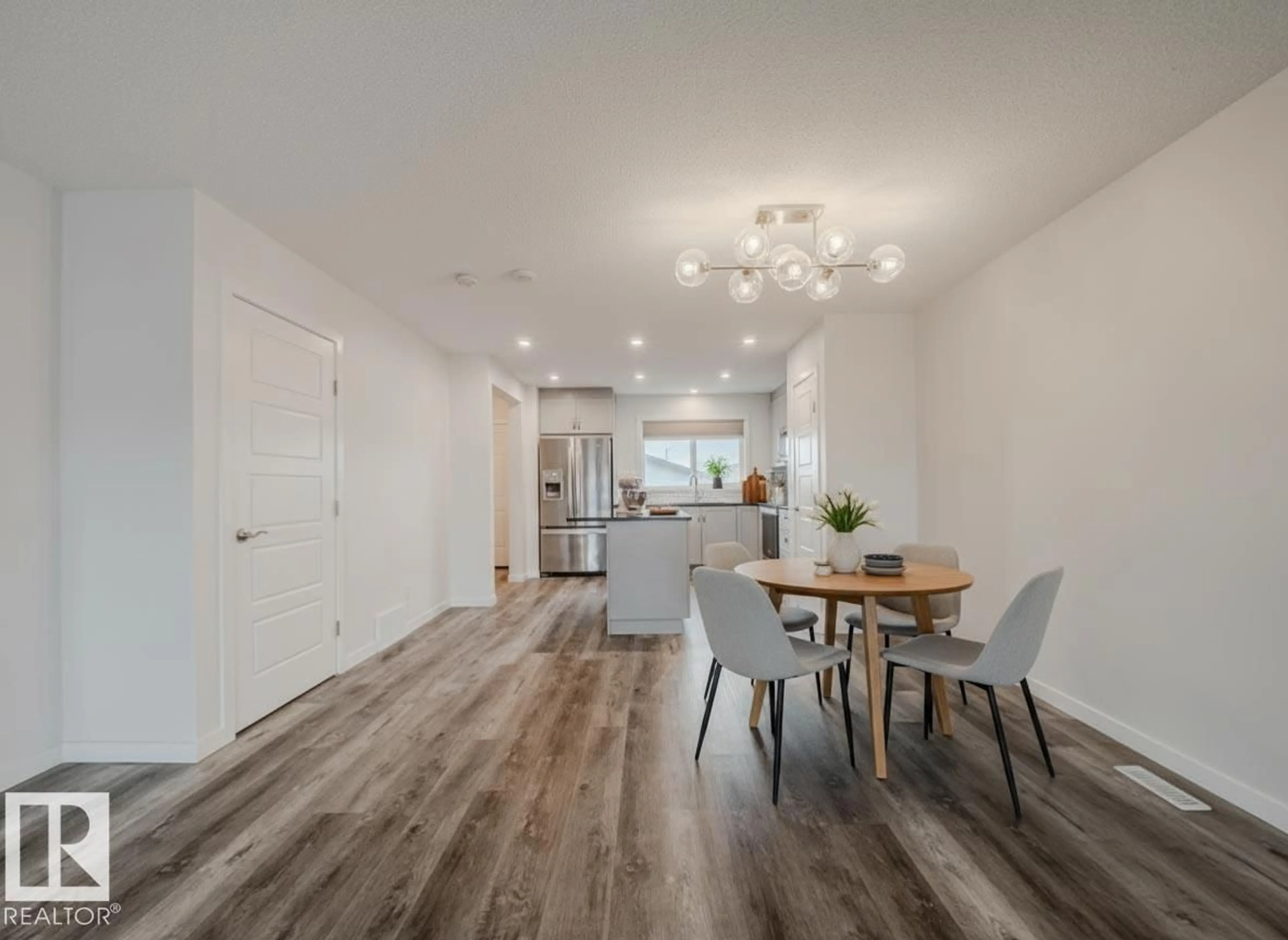 Open concept kitchen, wood/laminate floor for 21007 130 AV, Edmonton Alberta T5S0L4