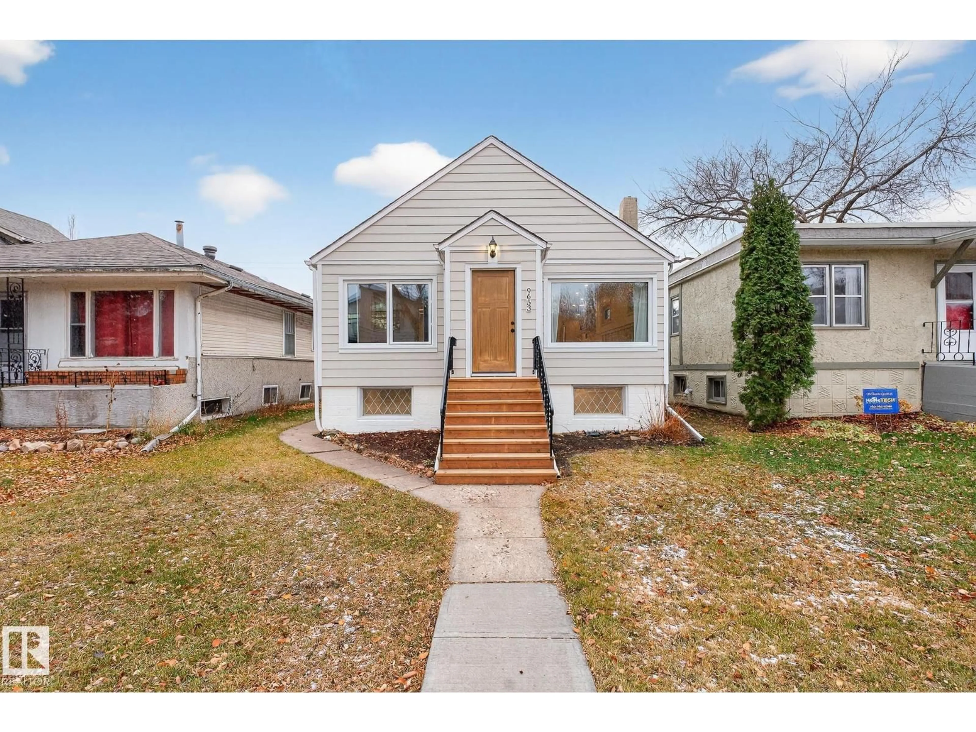 Home with vinyl exterior material, street for 9653 83 AV, Edmonton Alberta T6C1C1