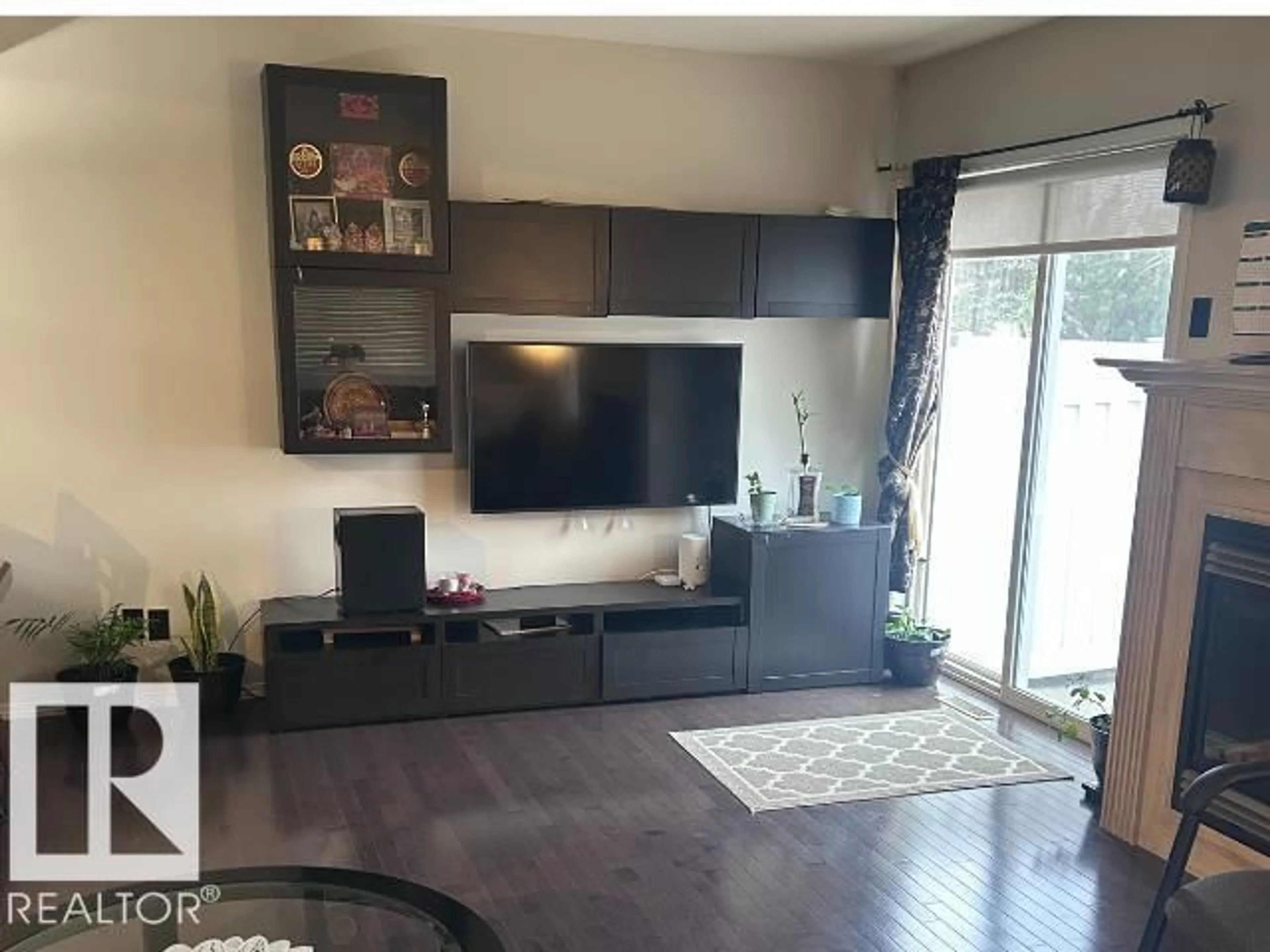 Living room with furniture, wood/laminate floor for 230 EDWARDS DRIVE SW, Edmonton Alberta T6X1G7