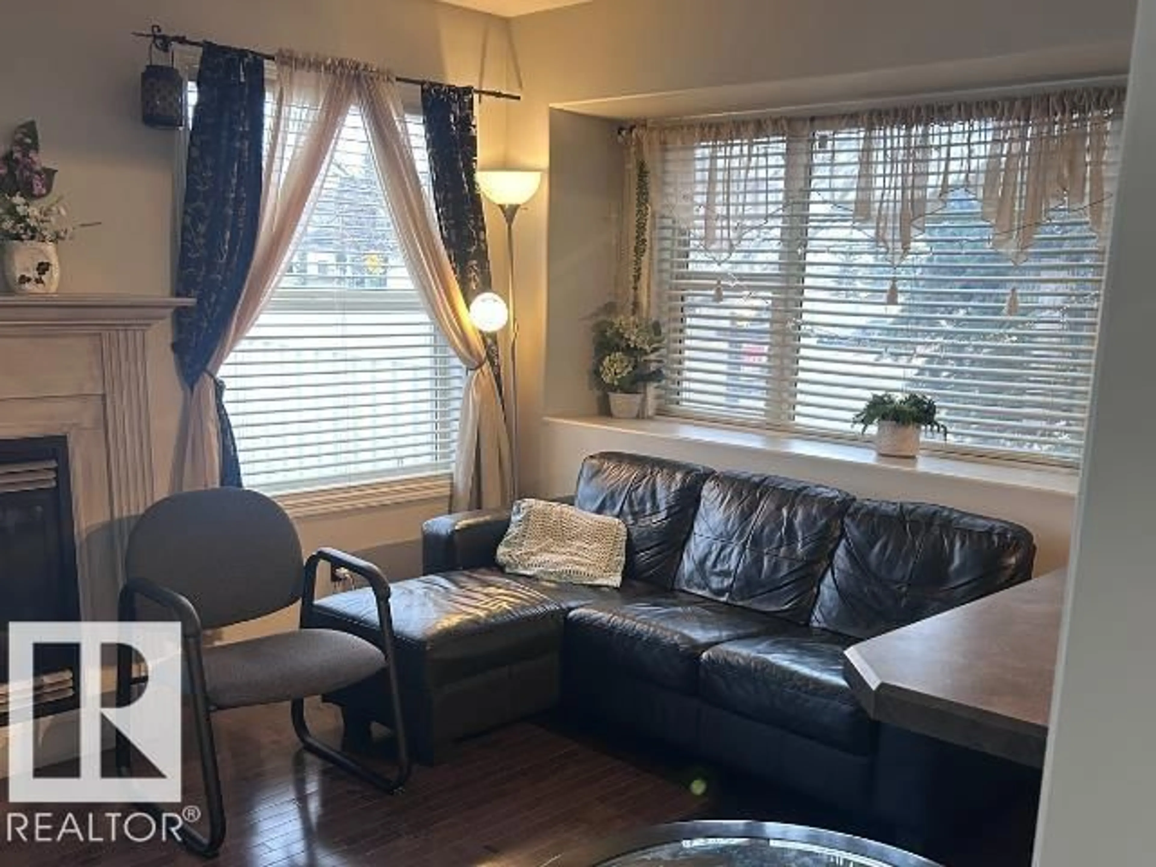 Living room with furniture, wood/laminate floor for 230 EDWARDS DRIVE SW, Edmonton Alberta T6X1G7