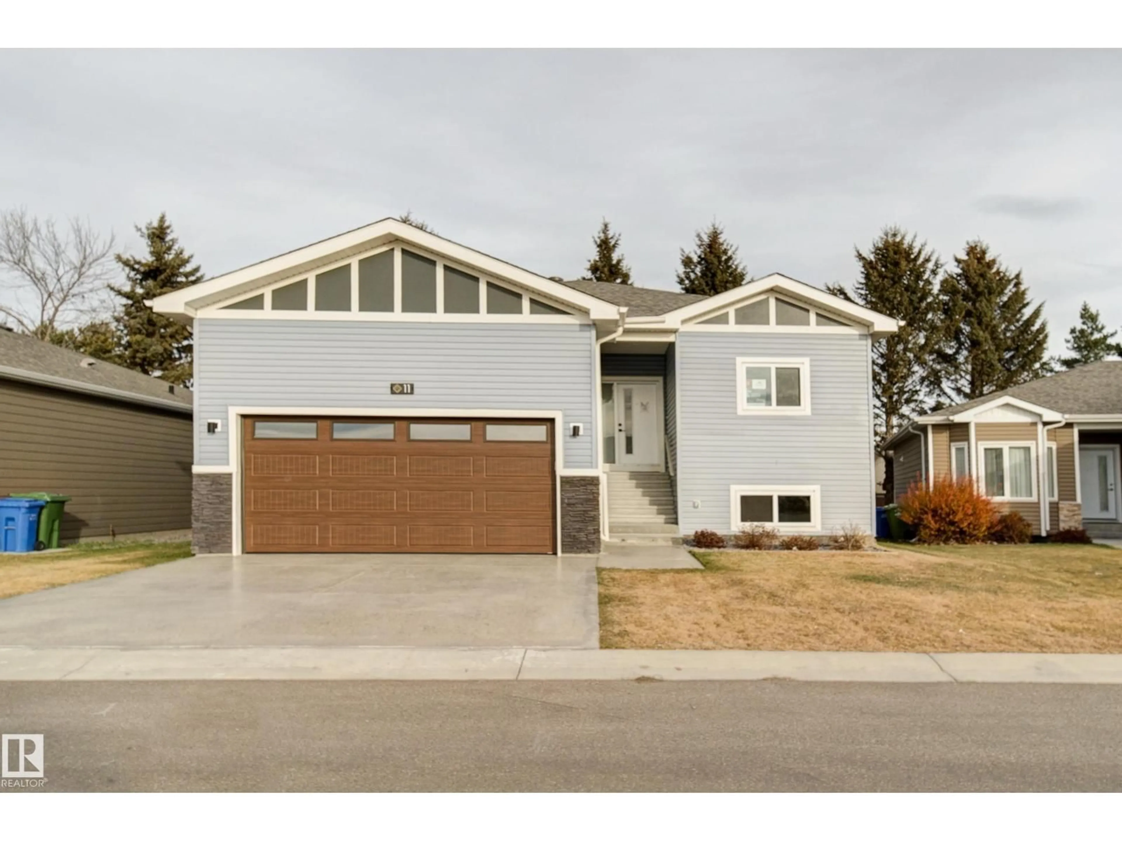 Home with vinyl exterior material, street for #11 - 6519 46 ST, Wetaskiwin Alberta T9A1Y5