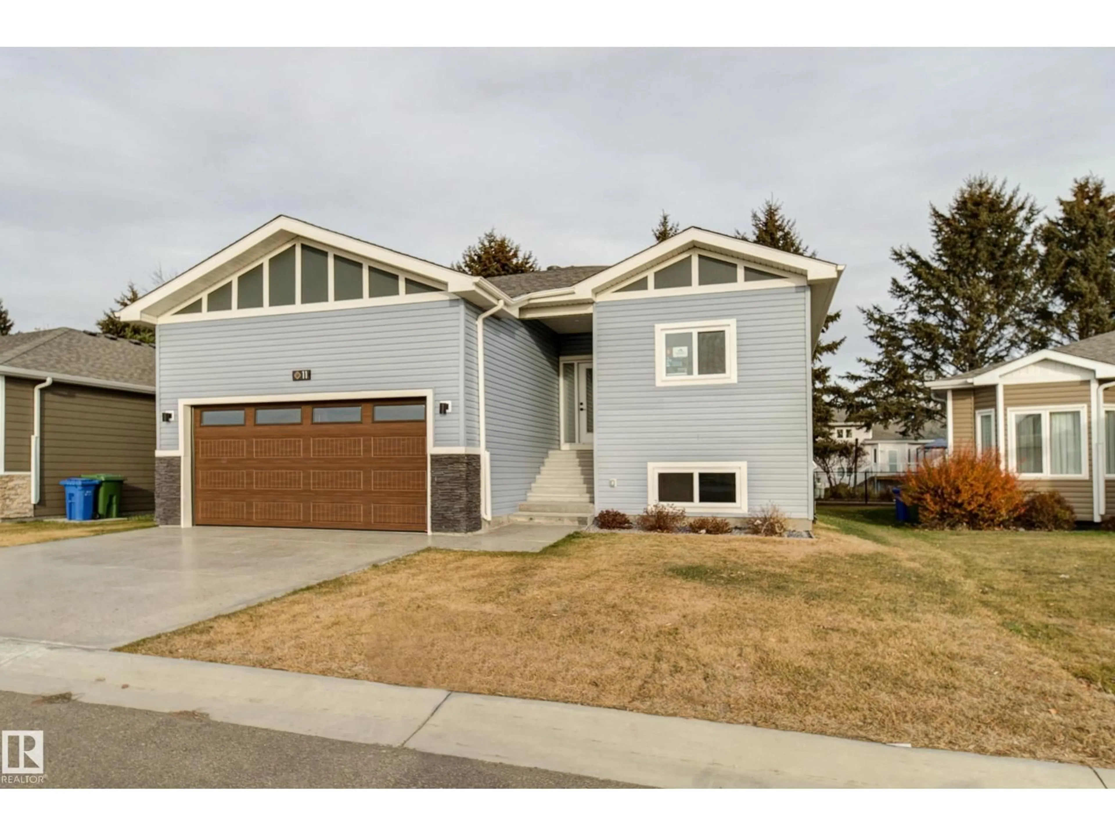Home with vinyl exterior material, street for #11 - 6519 46 ST, Wetaskiwin Alberta T9A1Y5