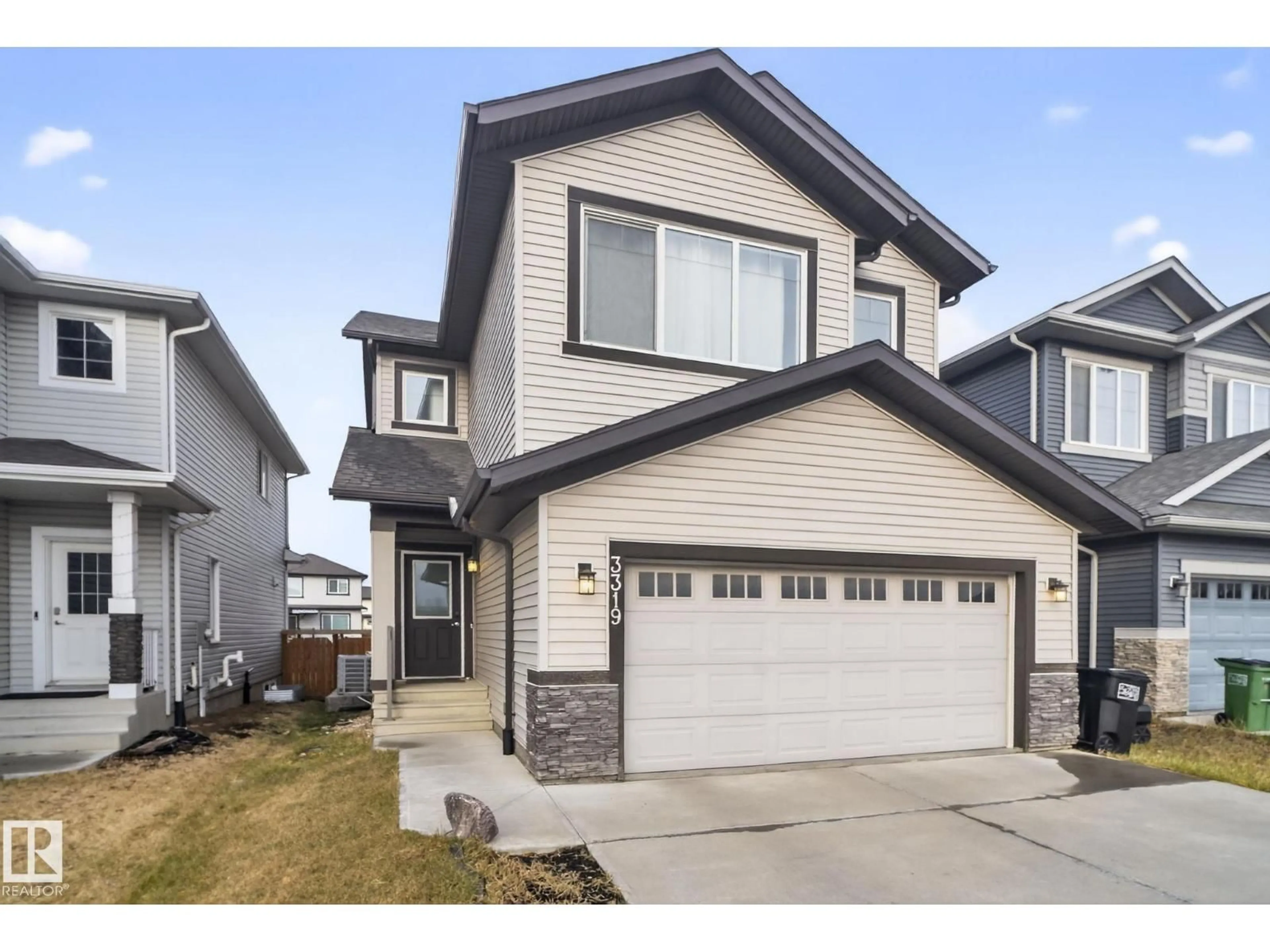 Home with vinyl exterior material, street for 3319 8 ST, Edmonton Alberta T6T1A4