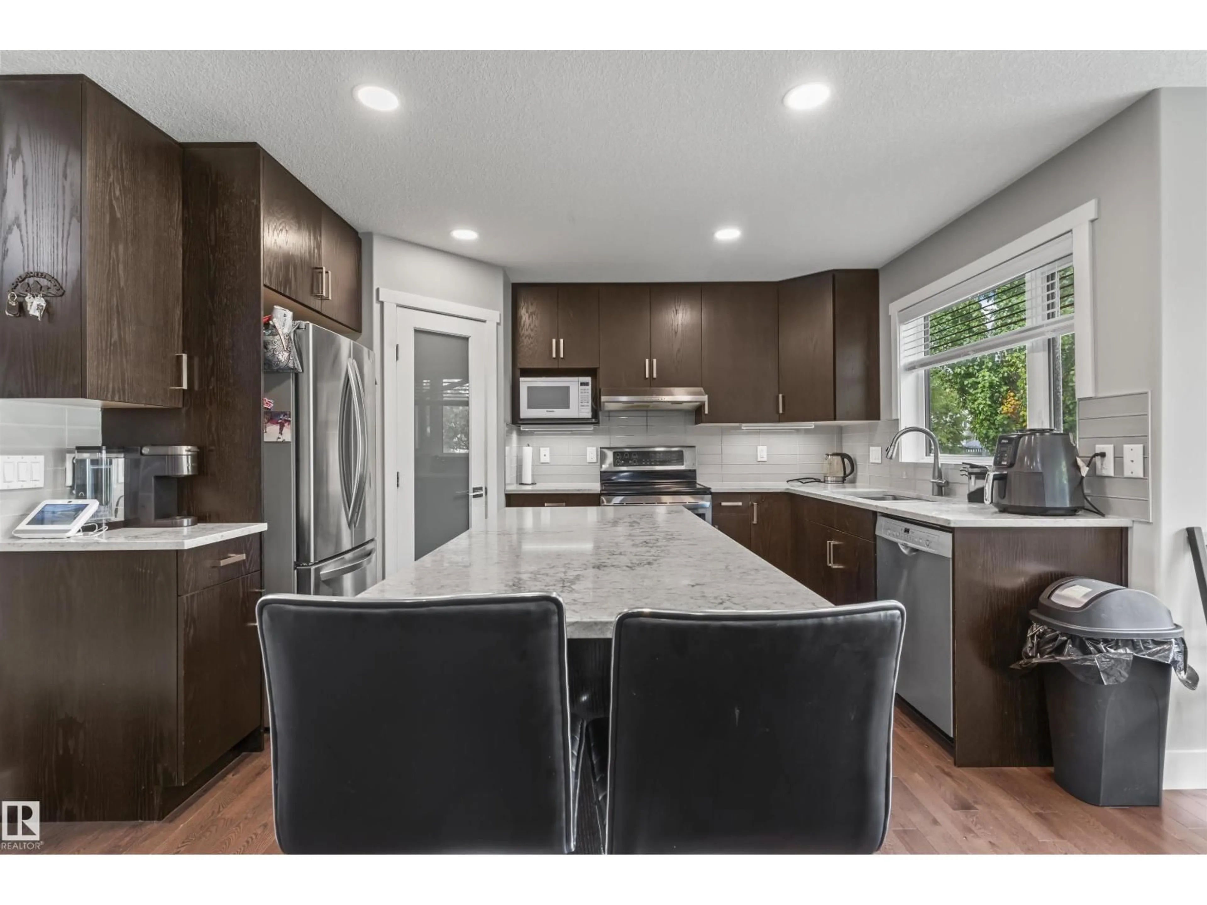 Open concept kitchen, ceramic/tile floor for 3747 30 ST, Edmonton Alberta T6T1H7