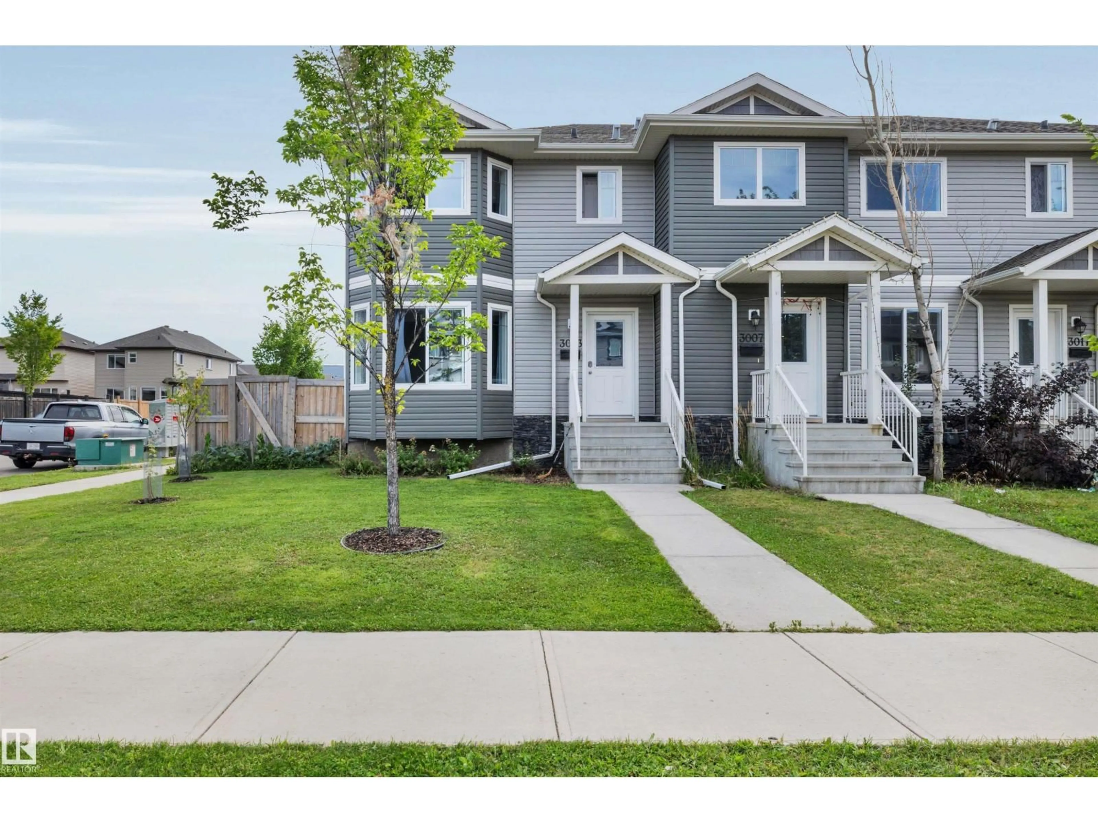 Home with vinyl exterior material, street for 3003 16 AV, Edmonton Alberta T6T0T9