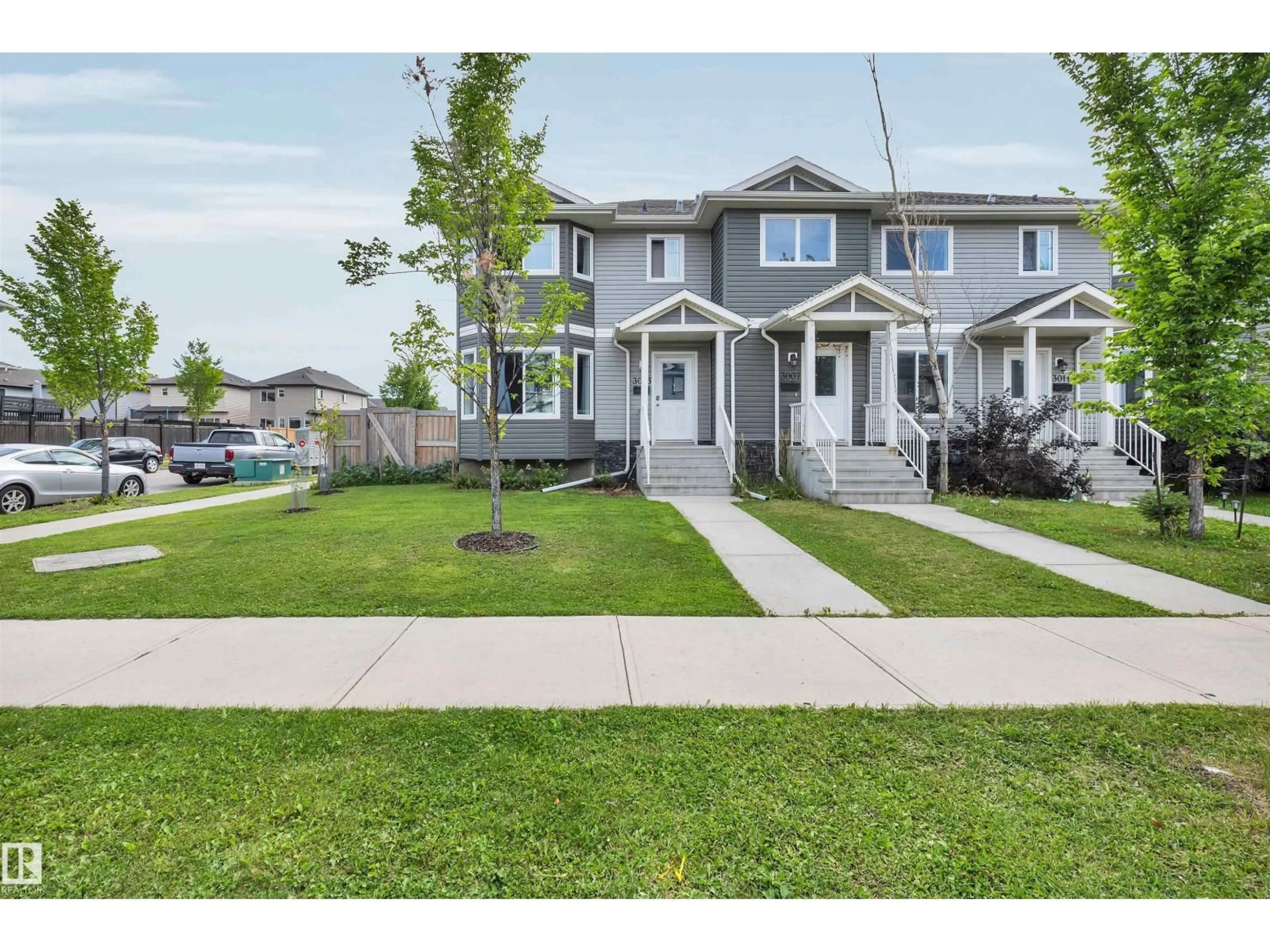 Home with vinyl exterior material, street for 3003 16 AV, Edmonton Alberta T6T0T9