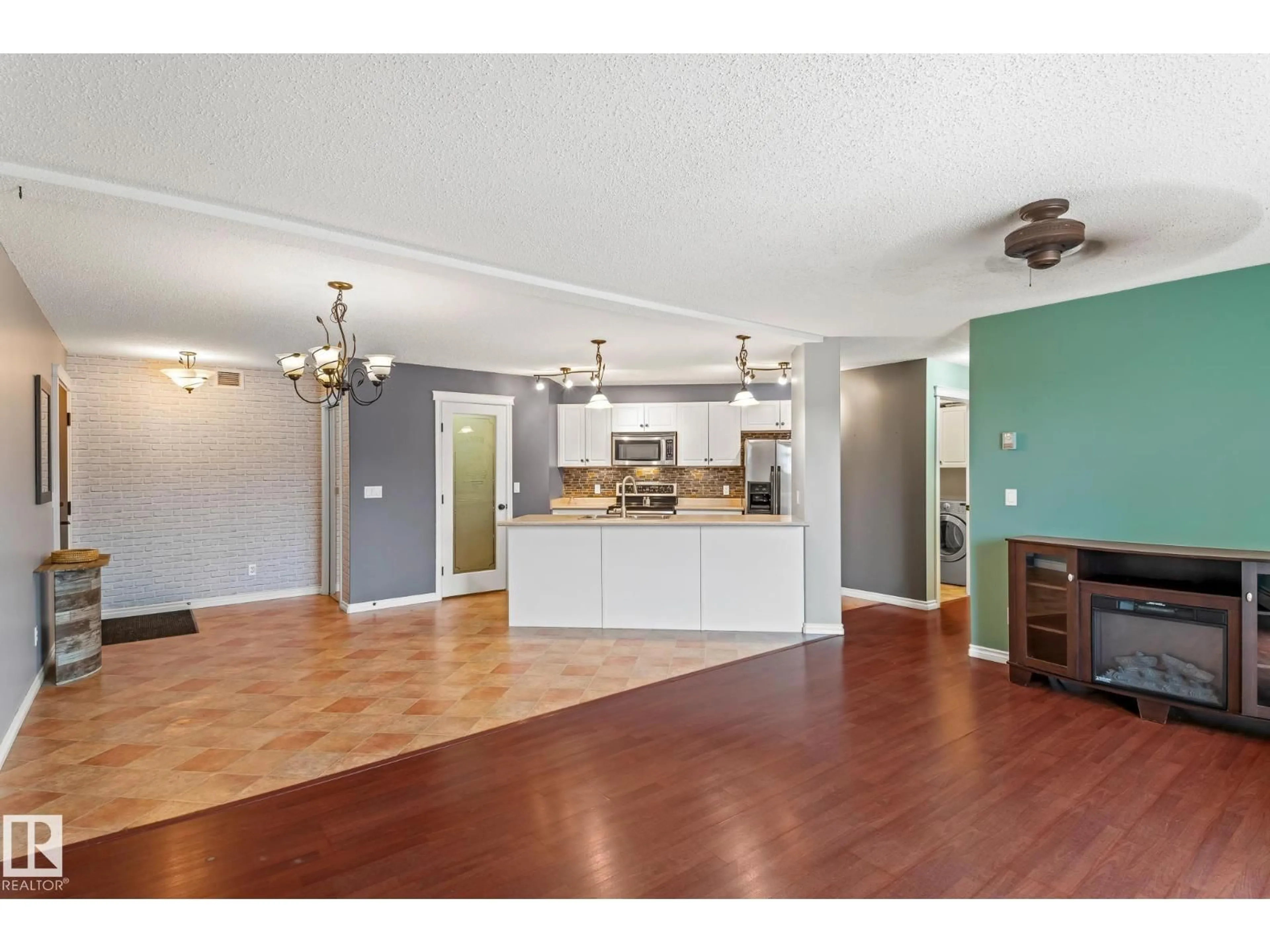 Open concept kitchen, wood/laminate floor for 2202 901 16 ST, Cold Lake Alberta T9M0C3