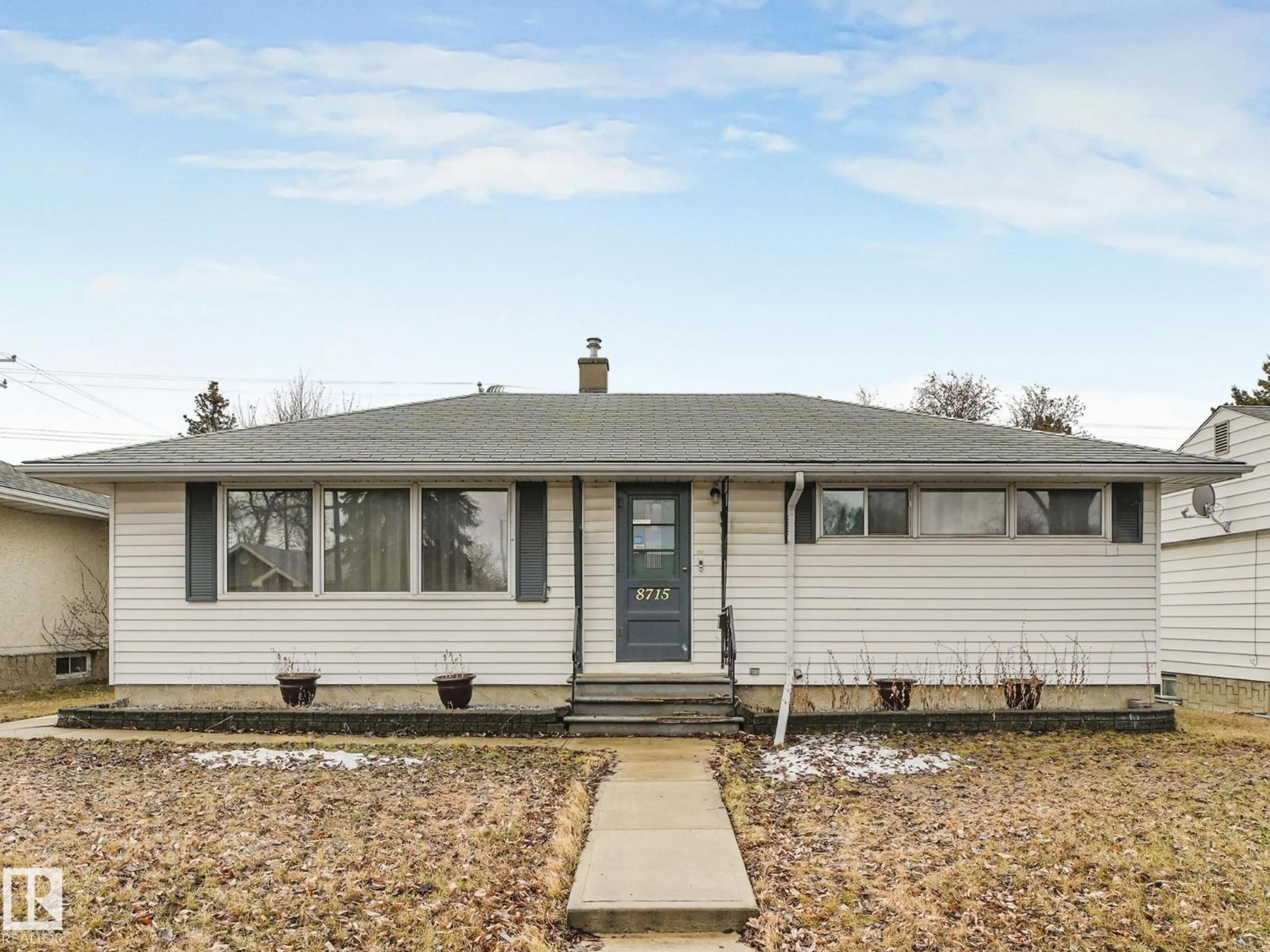 Home with vinyl exterior material, street for 8715 64 AV, Edmonton Alberta T6E0H4