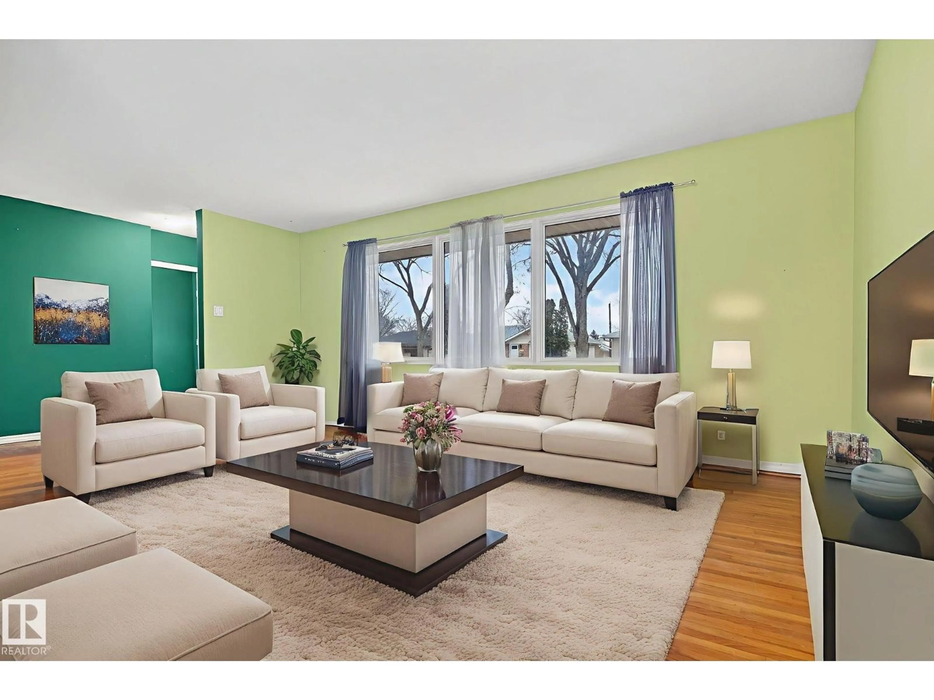 Living room with furniture, wood/laminate floor for 8715 64 AV, Edmonton Alberta T6E0H4