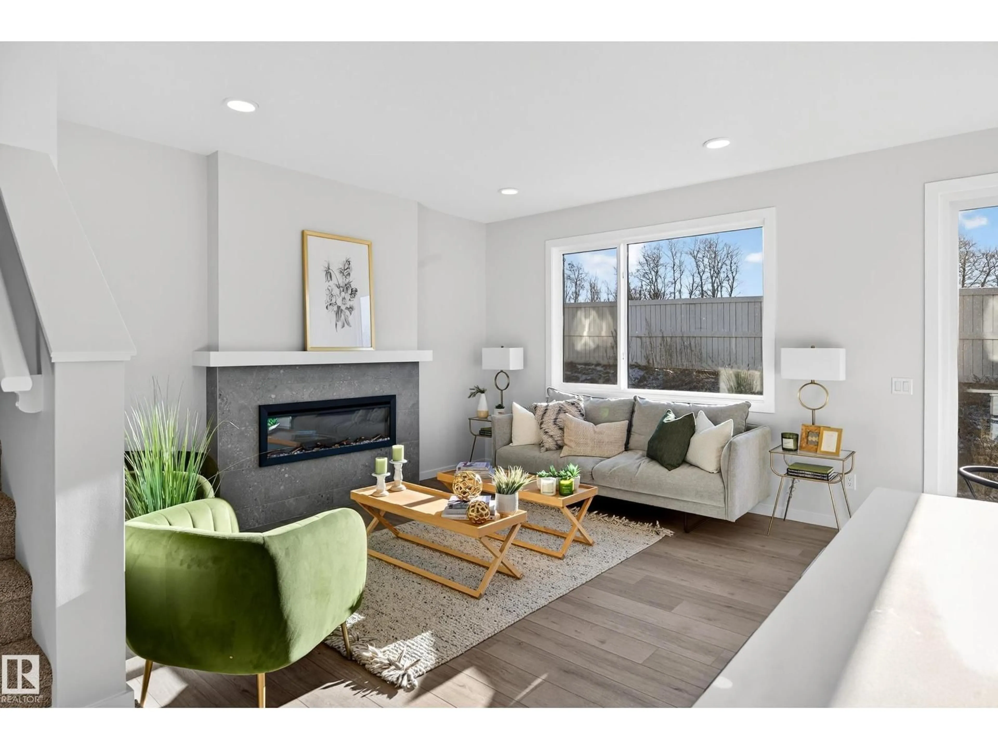 Living room with furniture, wood/laminate floor for 105 STONEHOUSE WY, Leduc Alberta T9E1R1