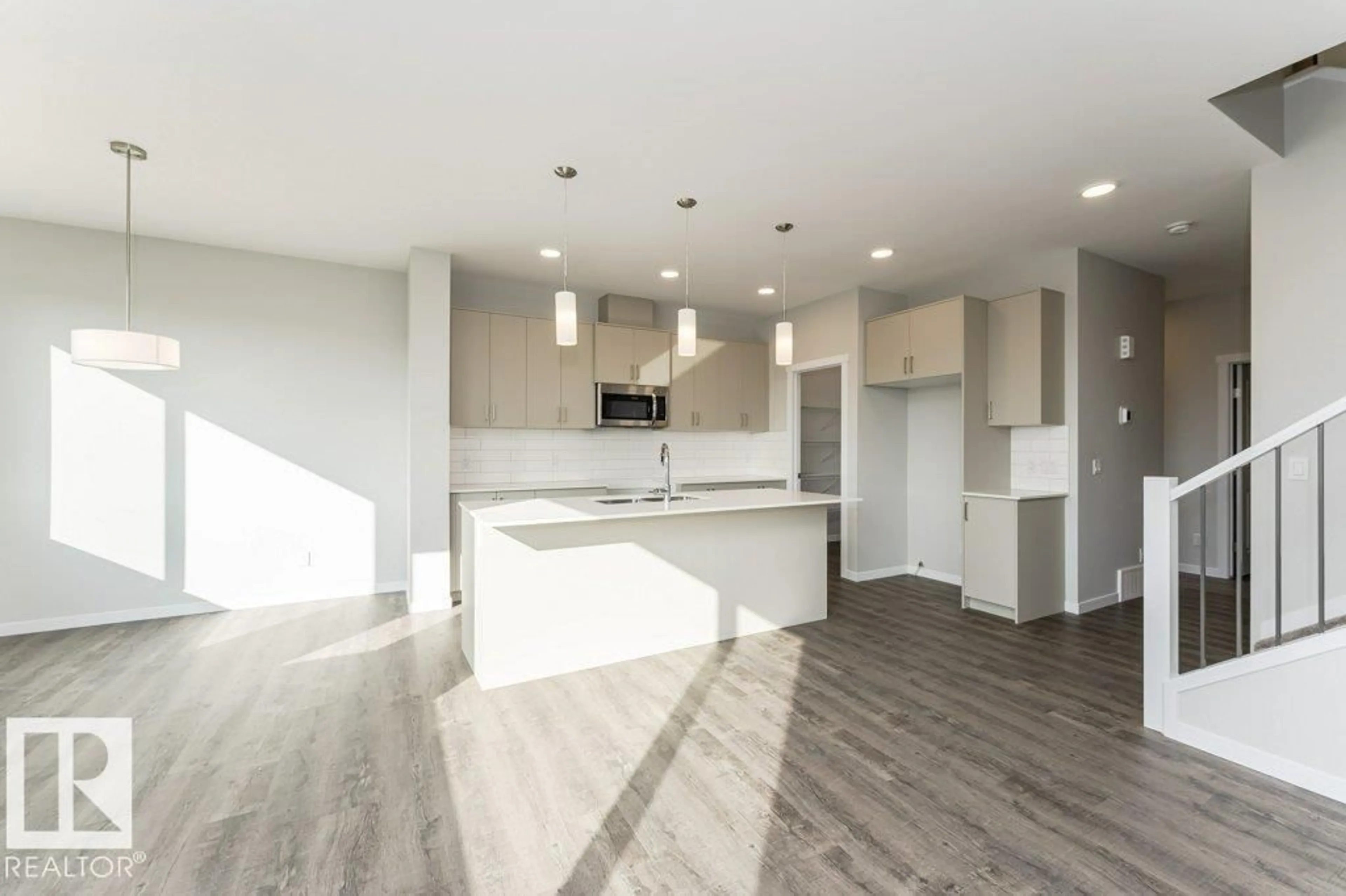 Open concept kitchen, wood/laminate floor for 2357 EGRET WY, Edmonton Alberta T6M3G8