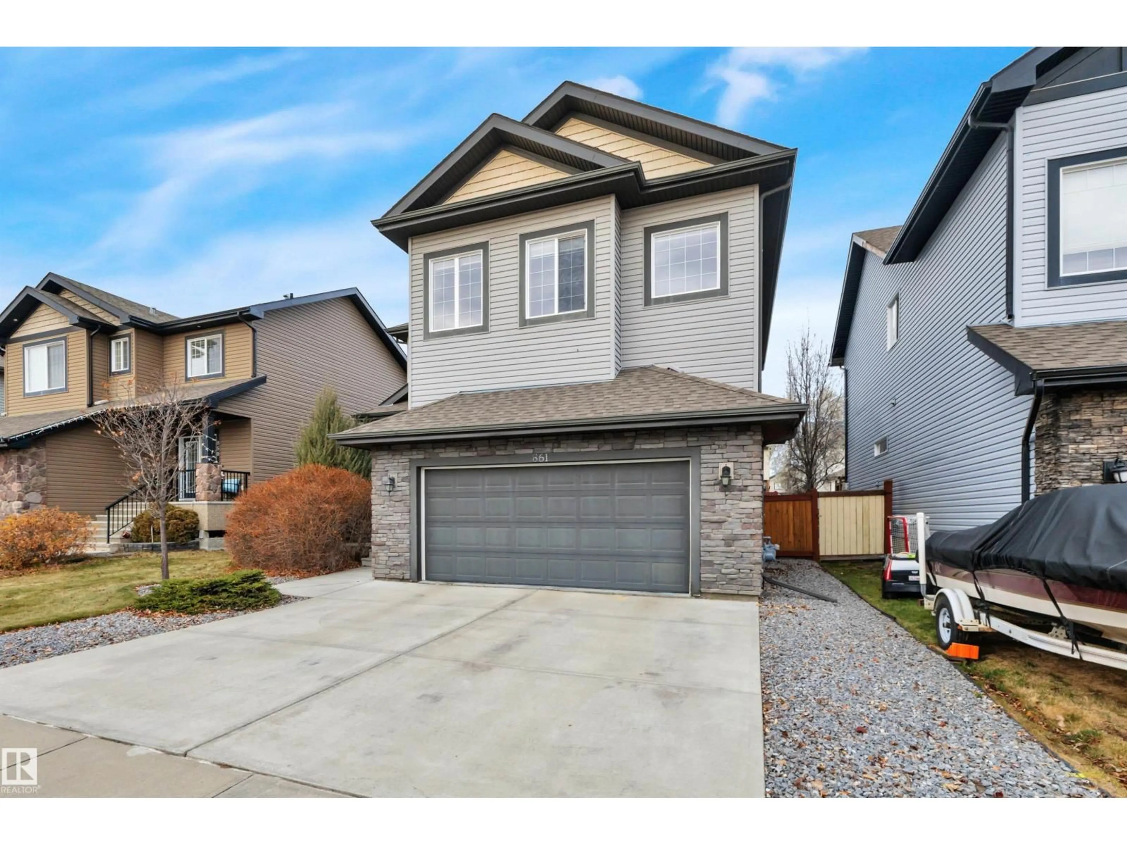 Home with vinyl exterior material, street for 861 SOUTHFORK GR, Leduc Alberta T9E0P5