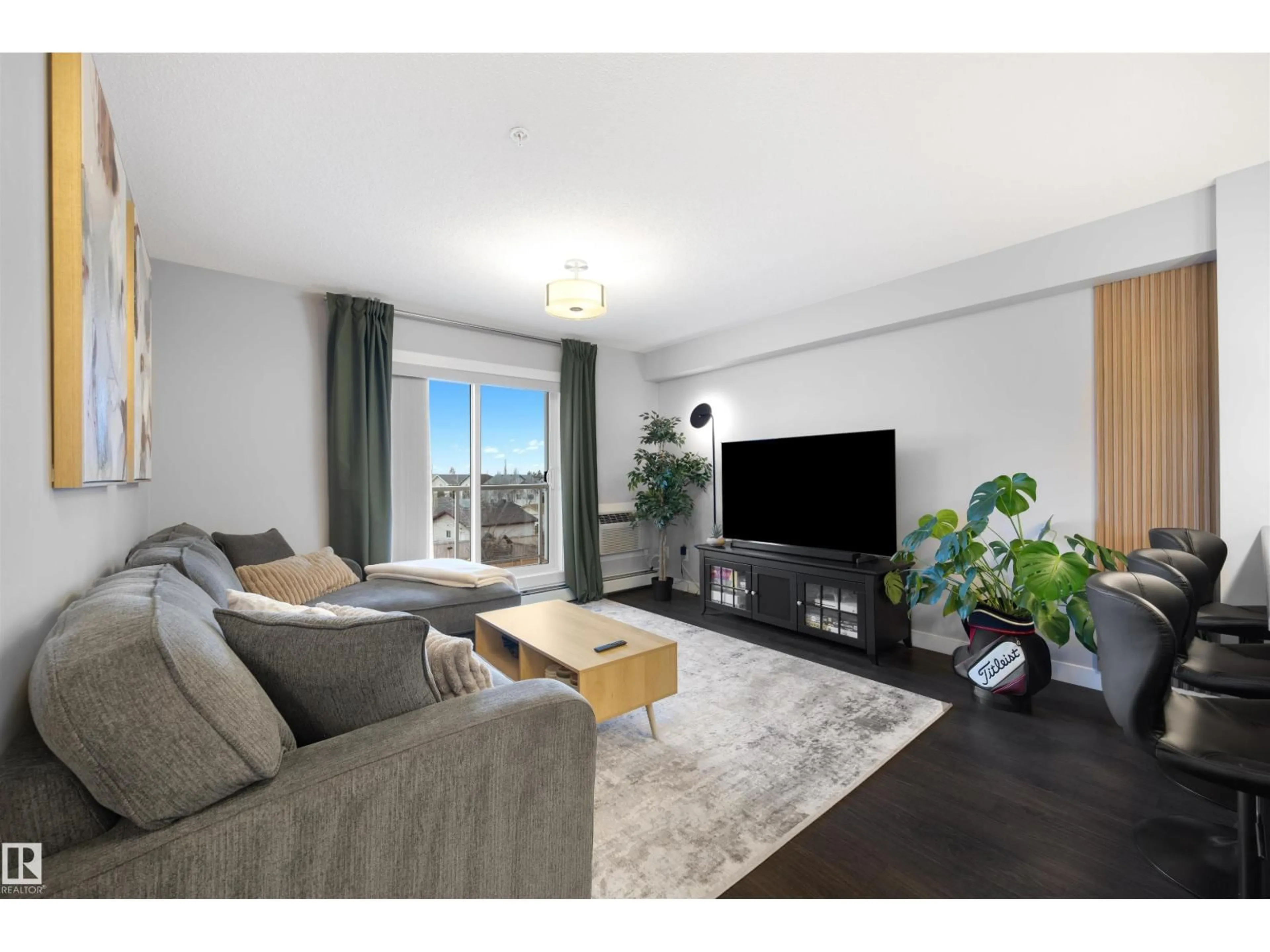 Living room with furniture, wood/laminate floor for #313 - 2229 44 AV NW, Edmonton Alberta T6T0W6