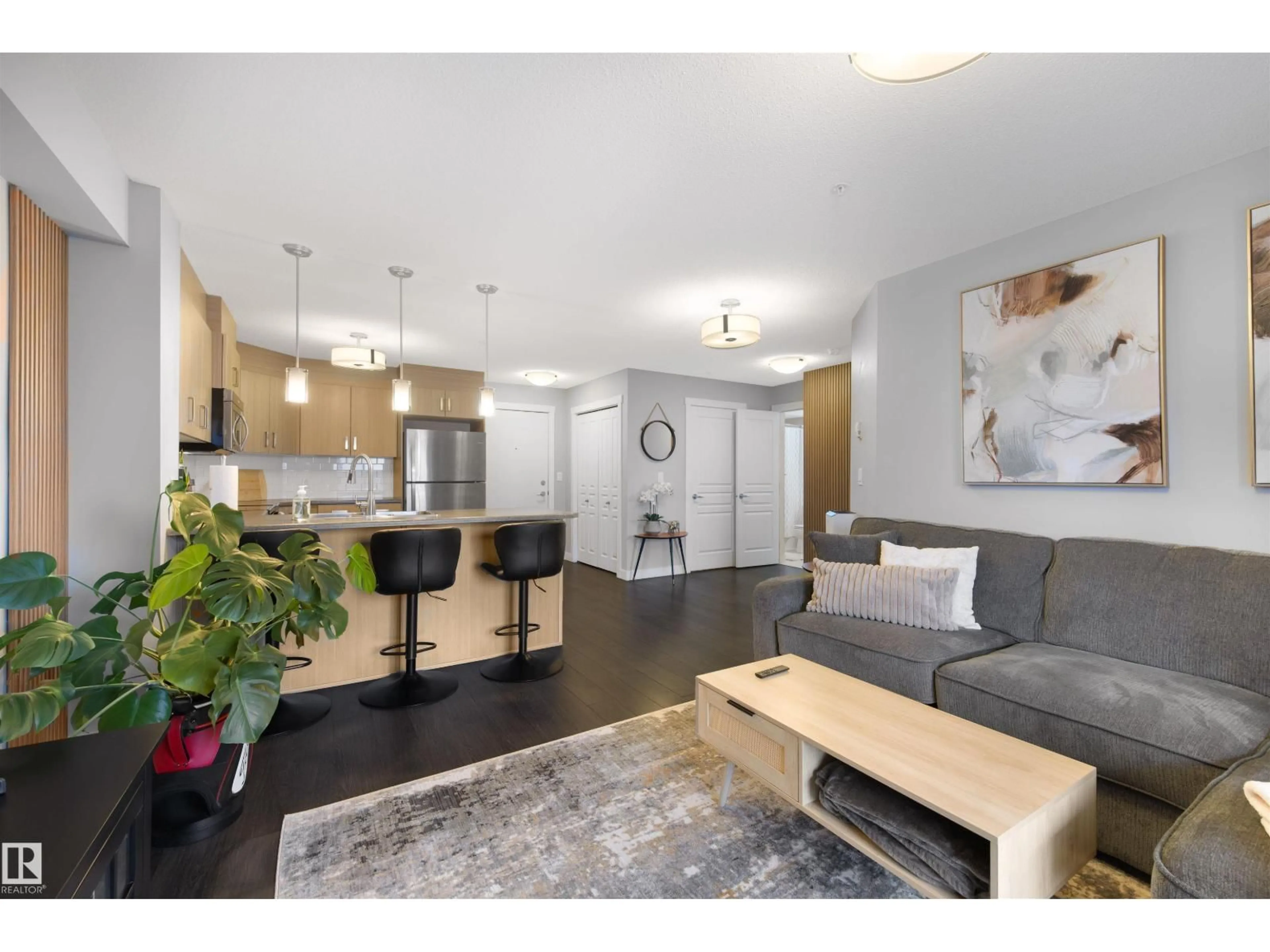 Living room with furniture, wood/laminate floor for #313 - 2229 44 AV NW, Edmonton Alberta T6T0W6