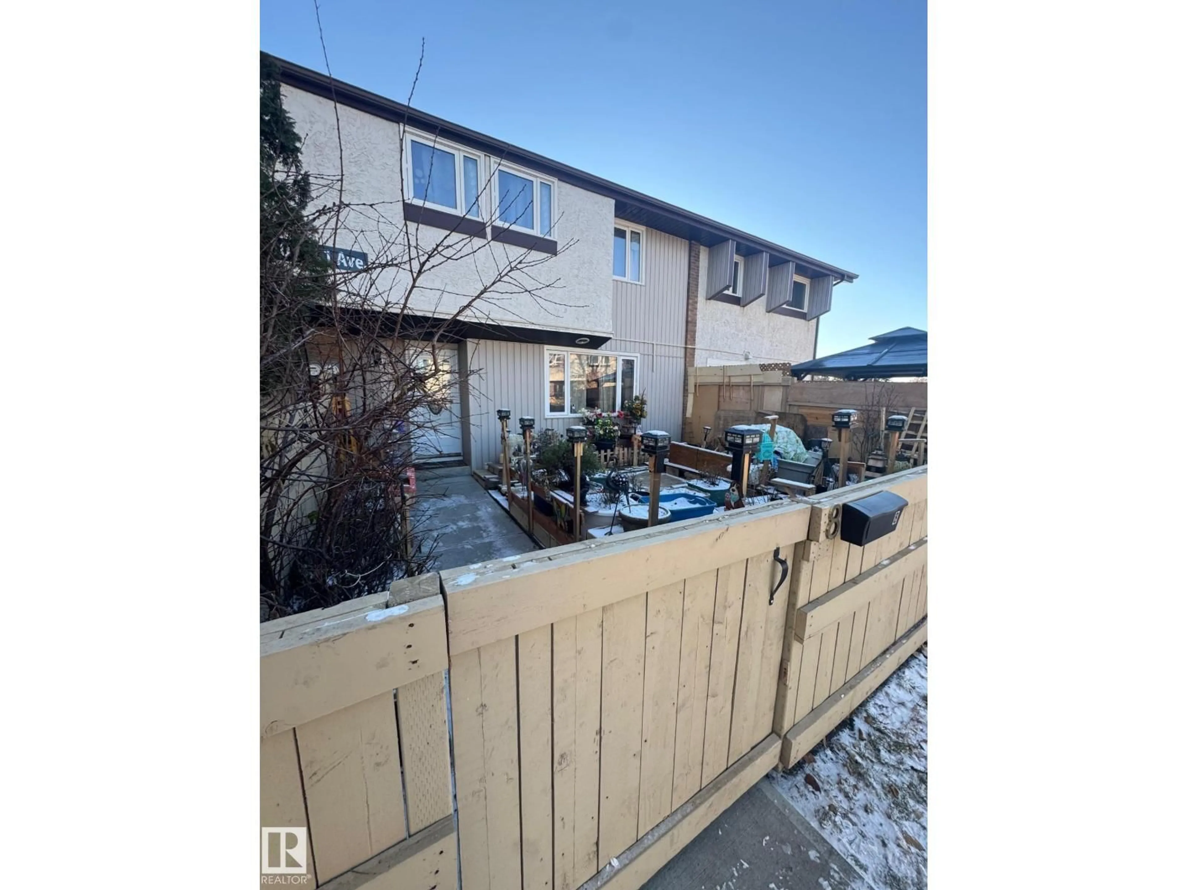 A pic from outside/outdoor area/front of a property/back of a property/a pic from drone, street for 8 - 8010 141 AV NW, Edmonton Alberta T5C2N9