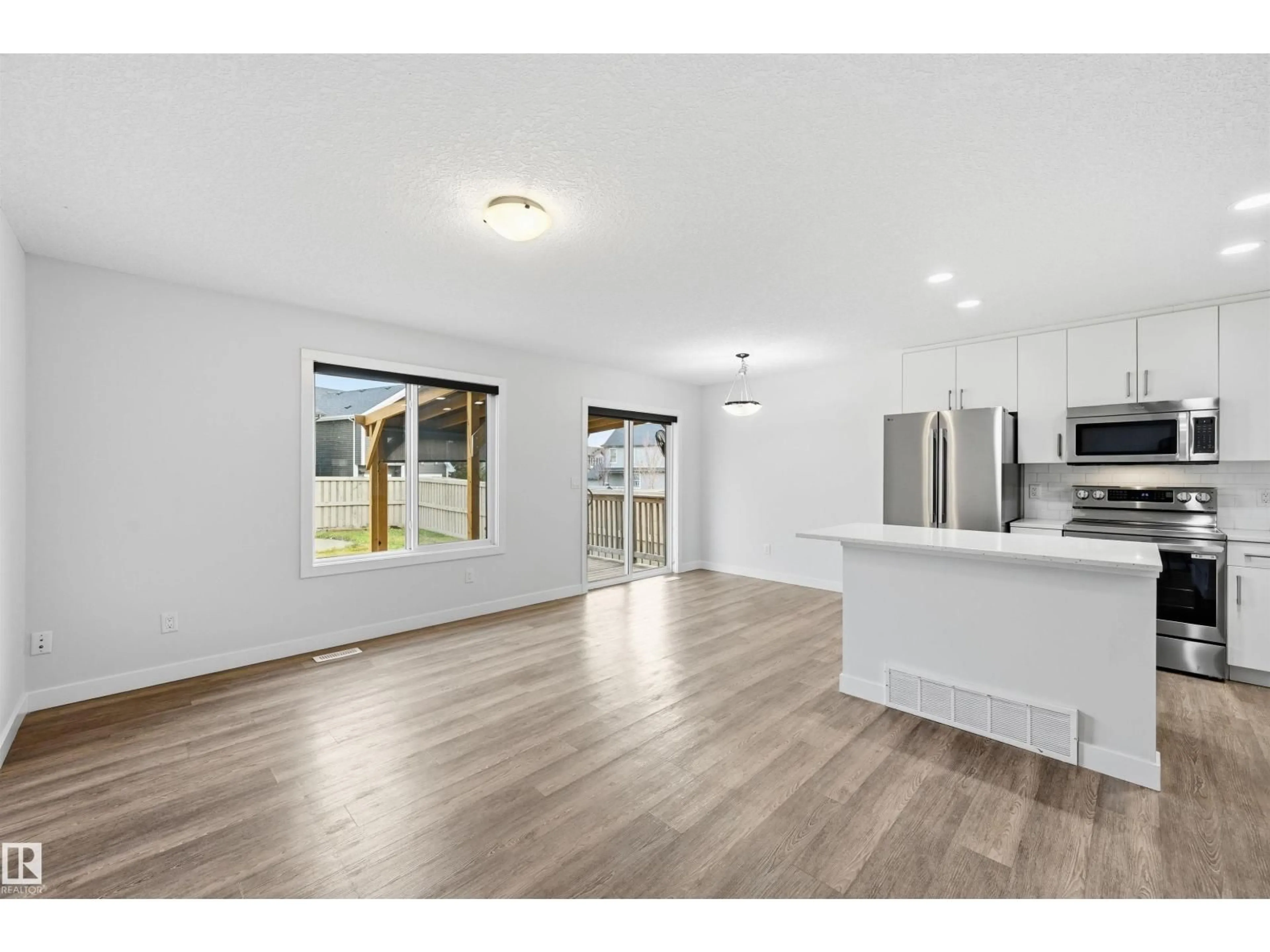 Open concept kitchen, wood/laminate floor for 3607 ATKINSON LO, Edmonton Alberta T6W0X3