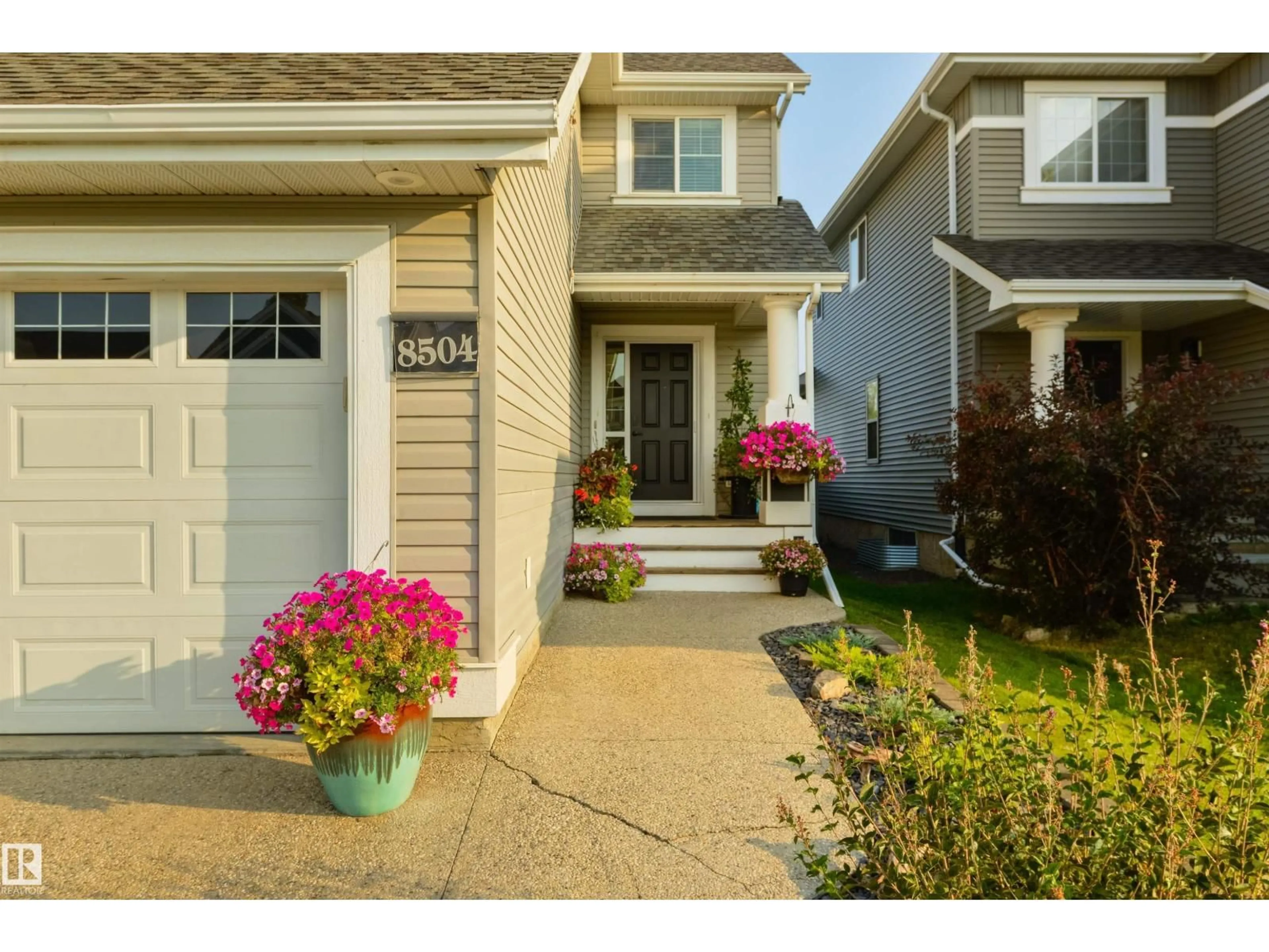 Home with vinyl exterior material, street for 8504 16A AV, Edmonton Alberta T6X0H9