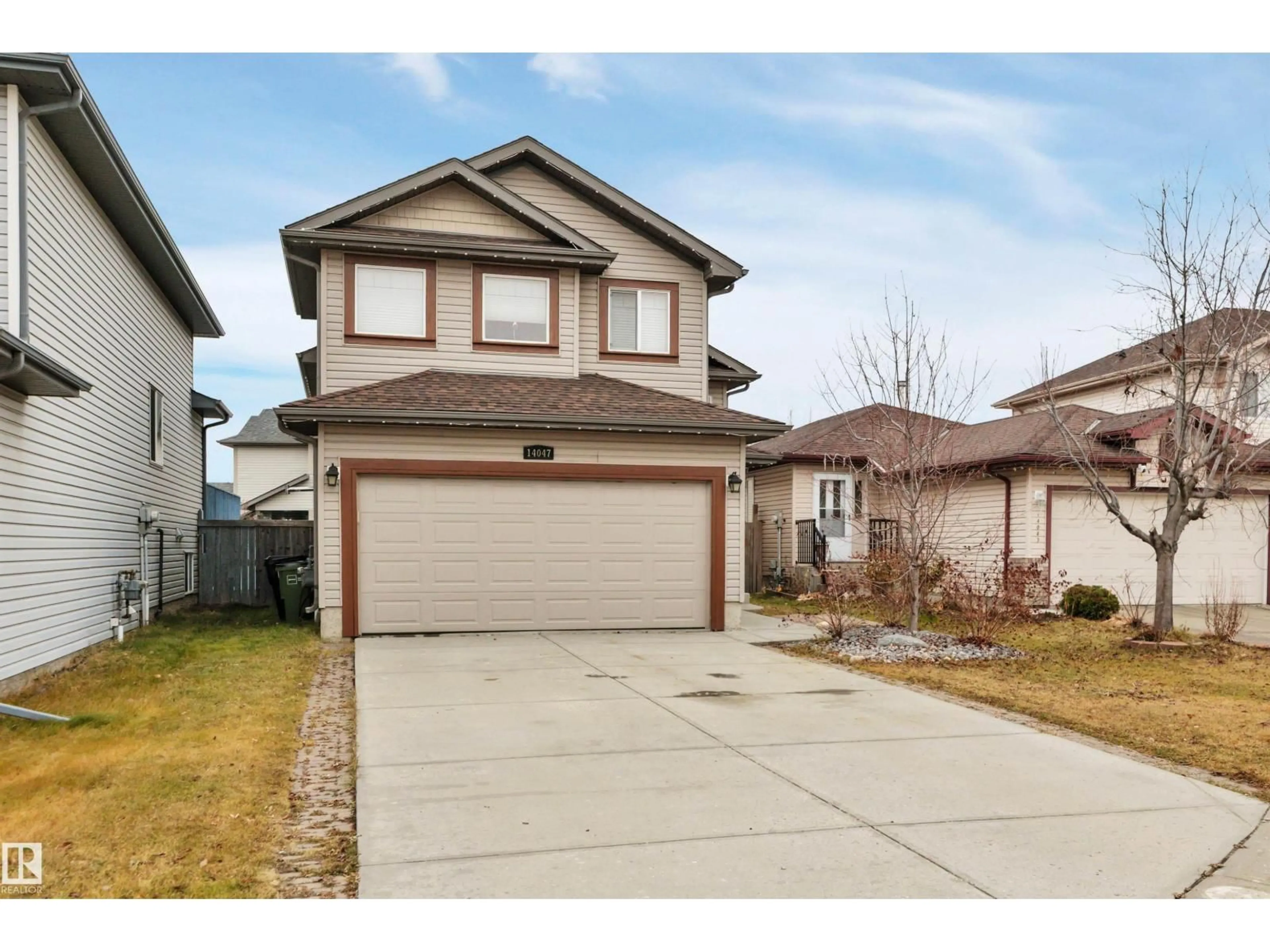 Home with vinyl exterior material, street for 14047 136 ST, Edmonton Alberta T6V1W8