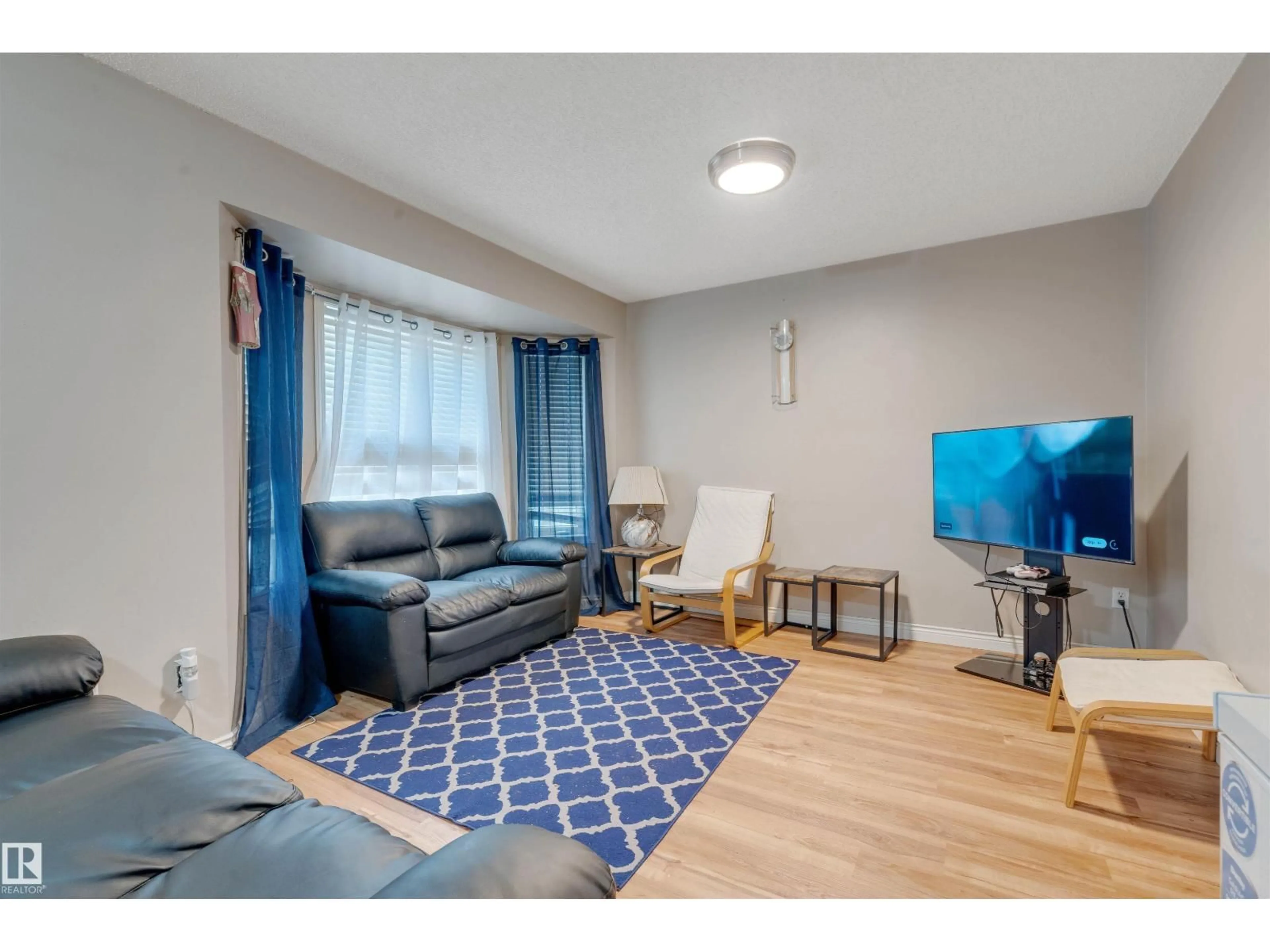 Living room with furniture, unknown for NW - 12957 - 12959 117 ST, Edmonton Alberta T5E5J8