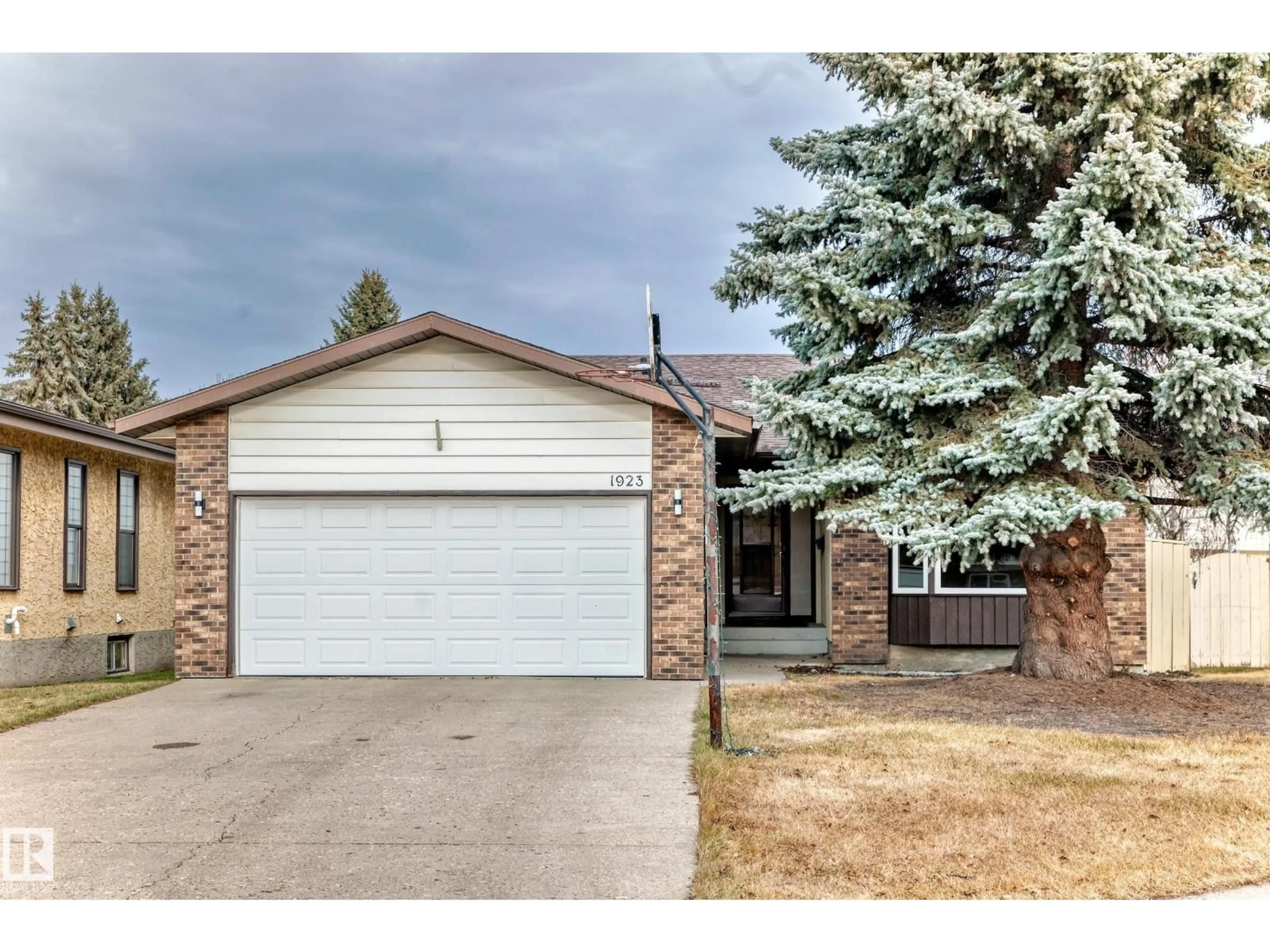 Home with brick exterior material, street for NW - 1923 52 ST, Edmonton Alberta T6L1J3