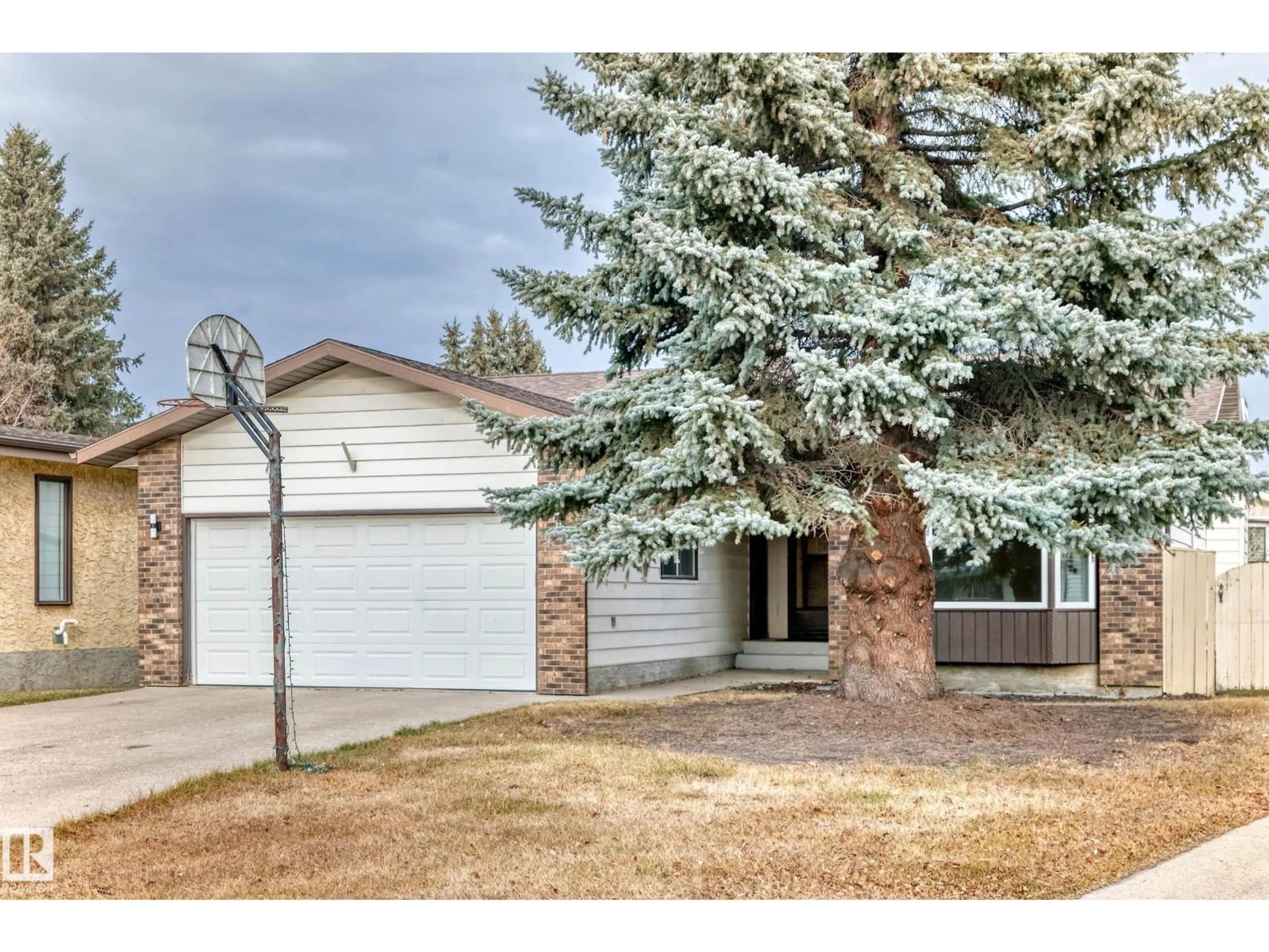 Home with vinyl exterior material, street for NW - 1923 52 ST, Edmonton Alberta T6L1J3