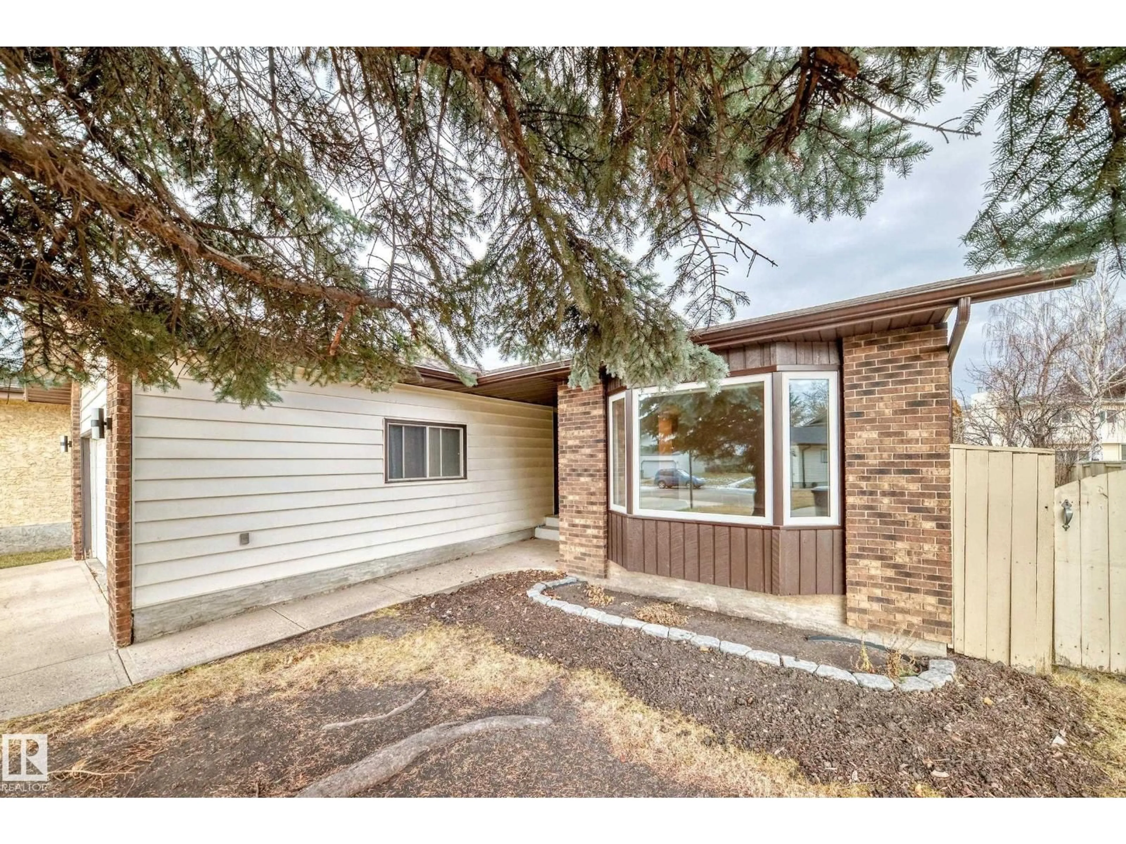 Home with vinyl exterior material, street for NW - 1923 52 ST, Edmonton Alberta T6L1J3